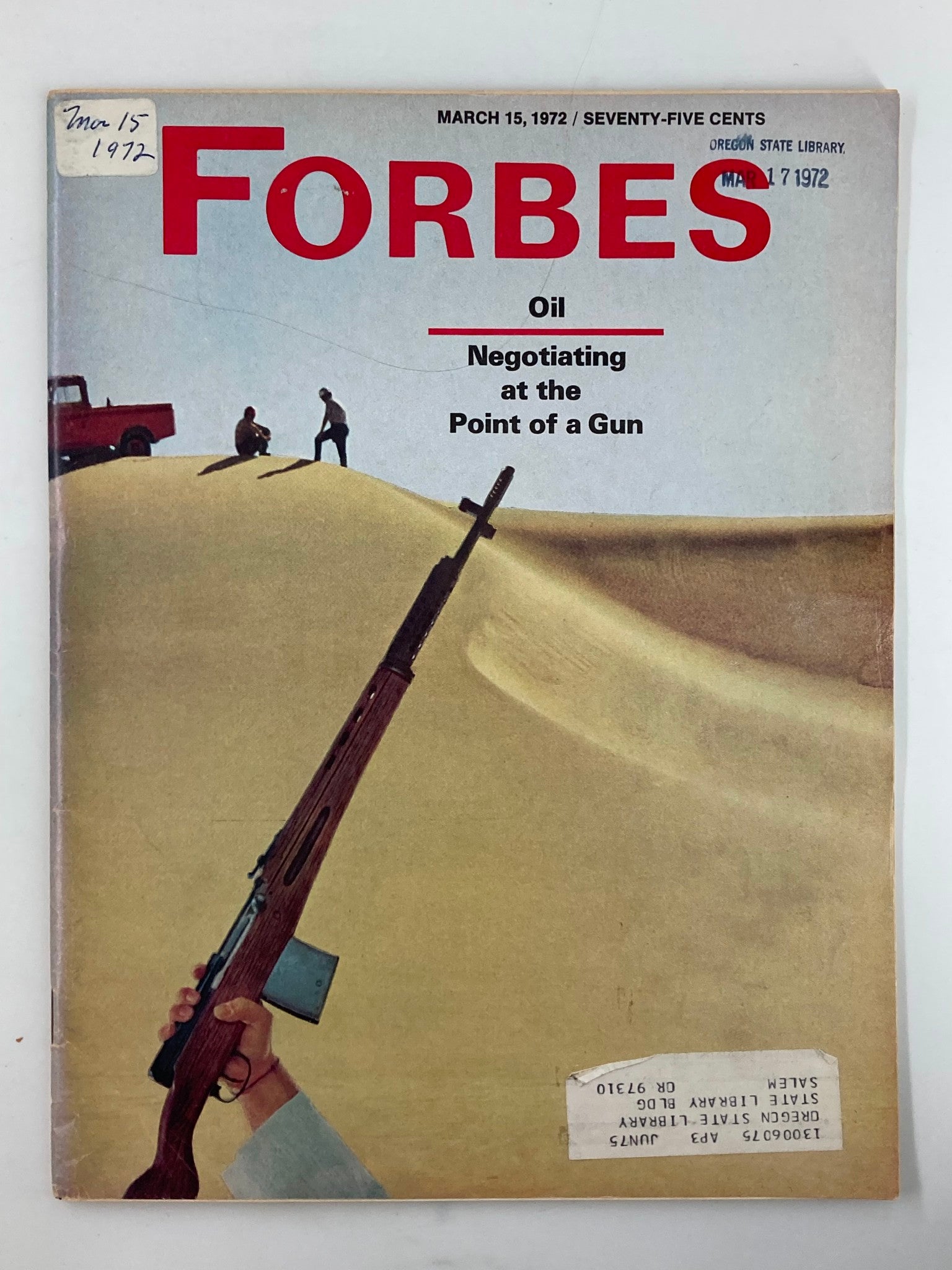 Vintage Forbes Magazine cover from March 15, 1972, titled 'Oil - Negotiating at the Point of a Gun.' The cover features a striking image of a person holding a rifle against a desert backdrop, symbolizing the tense political climate regarding oil negotiations during that era.