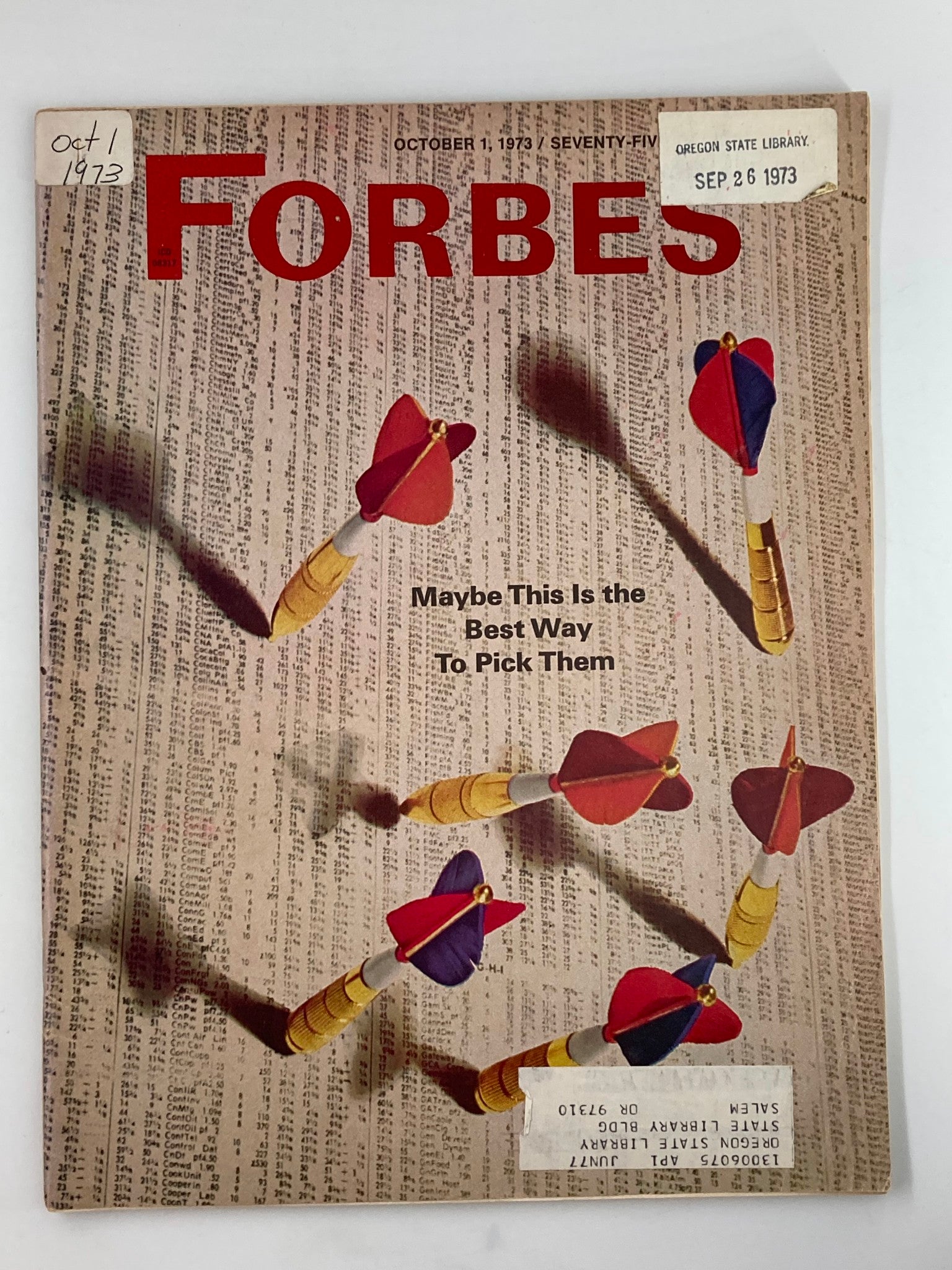 Vintage Forbes Magazine cover from October 1, 1973, featuring the title 'Maybe This Is The Best Way To Pick Them', with an illustration of colored darts over a background of financial data.