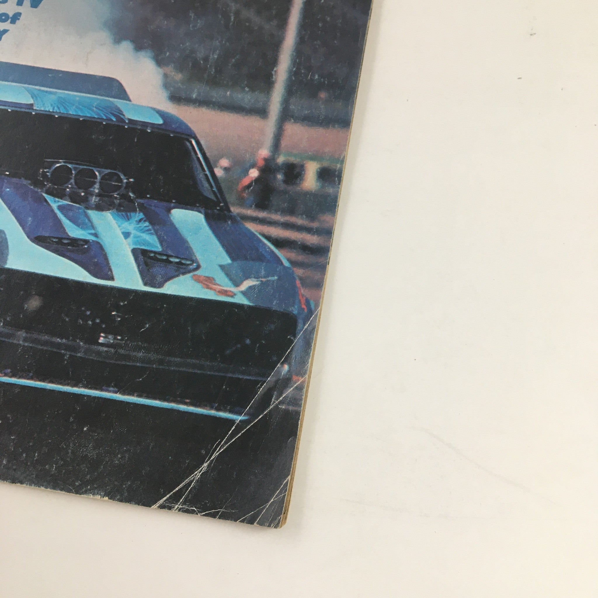 Close-up of the cover of Super Stock Magazine March 1977 showcasing the drag racing car featured. The image captures details of the artwork and the condition of the vintage magazine.