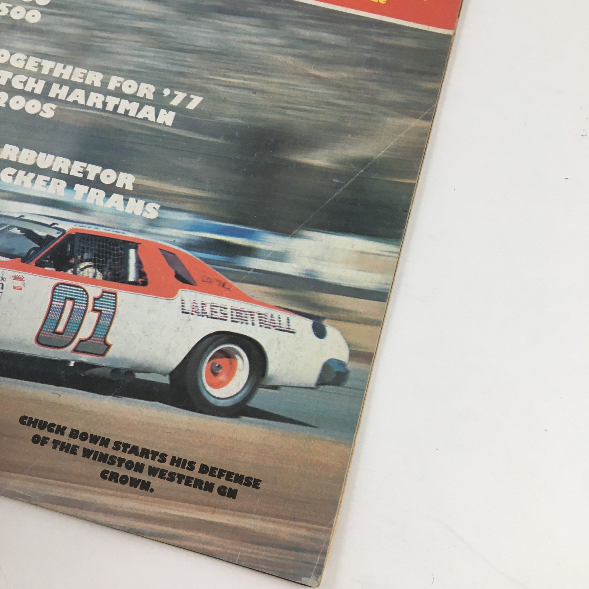 Cover of Stock Car Racing Magazine June 1977 featuring a stock car in motion with bold text highlighting Chuck Brown's defense of the Winston Western Crown.