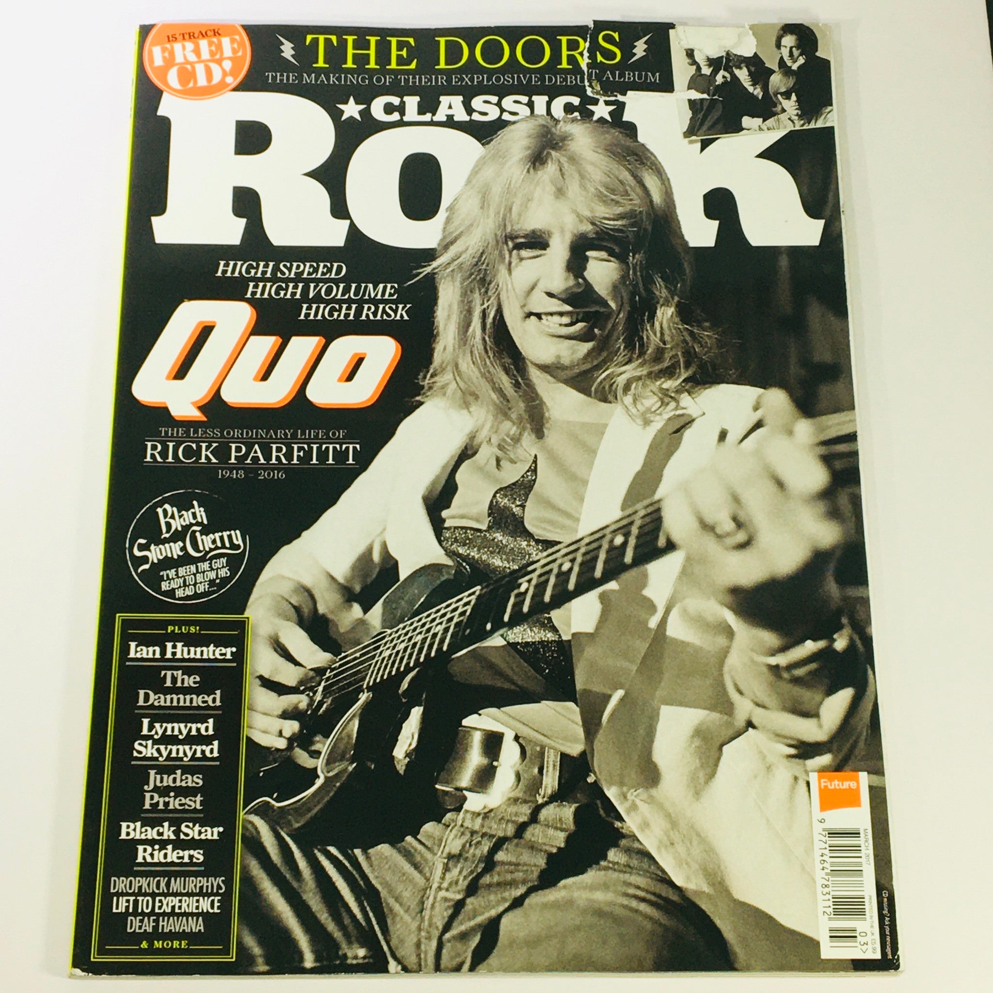 Cover of Classic Rock Magazine March 2017 #233 featuring The Doors and Rick Parfitt with a guitar, highlighting classic rock themes.
