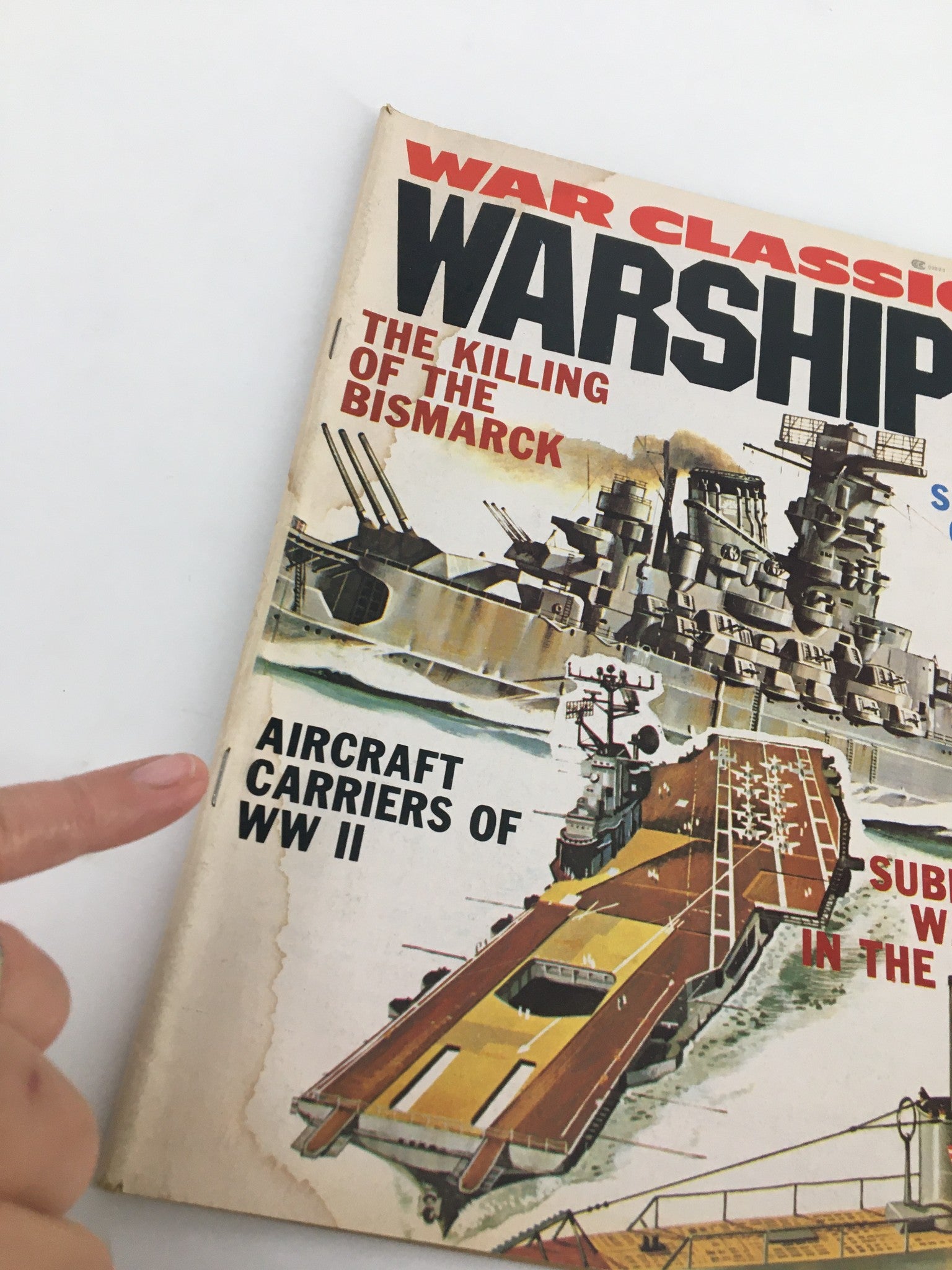 Cover of 'War Classics Magazine - February 1977' featuring a bold title 'WARSHIP' and an illustration depicting the killing of the Bismarck, along with a mention of 'Aircraft Carriers of WW II.'