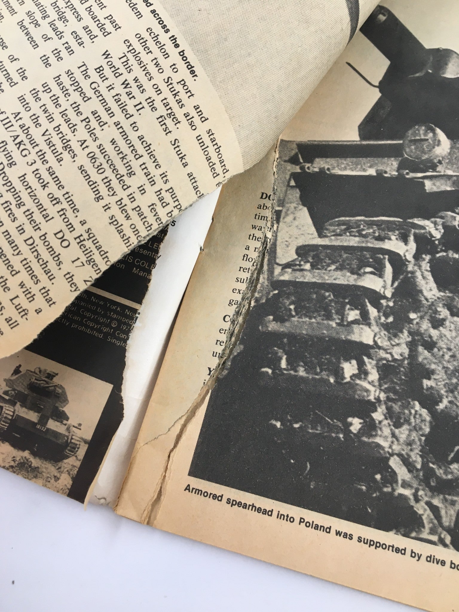 Close-up of a torn page in the VTG True War Magazine from March 1976, depicting U.S. Airborne Assaults and featuring black and white military imagery.