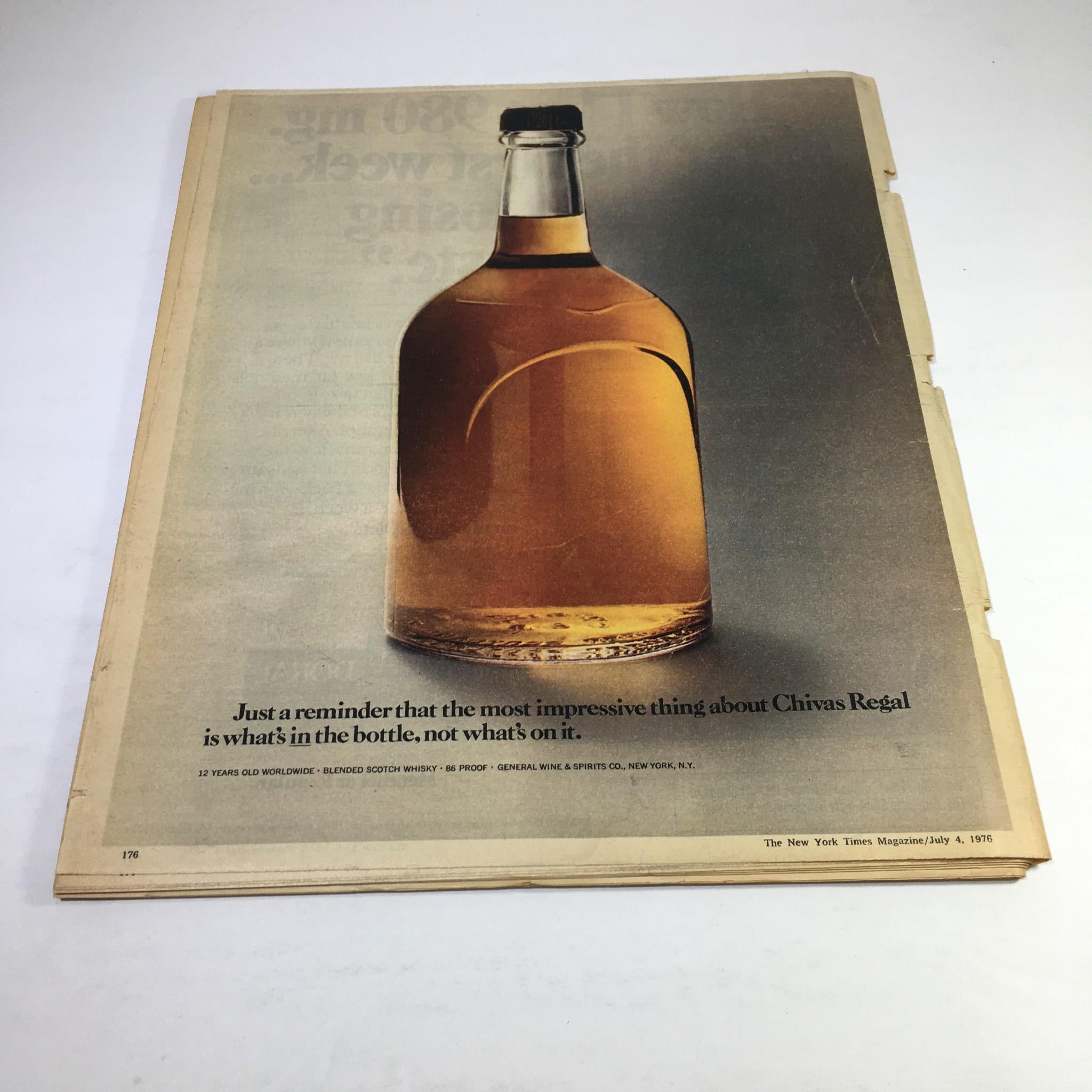 Ad page from The New York Times Magazine July 4, 1976, showcasing a bottle of Chivas Regal whisky with a caption about its impressive contents.