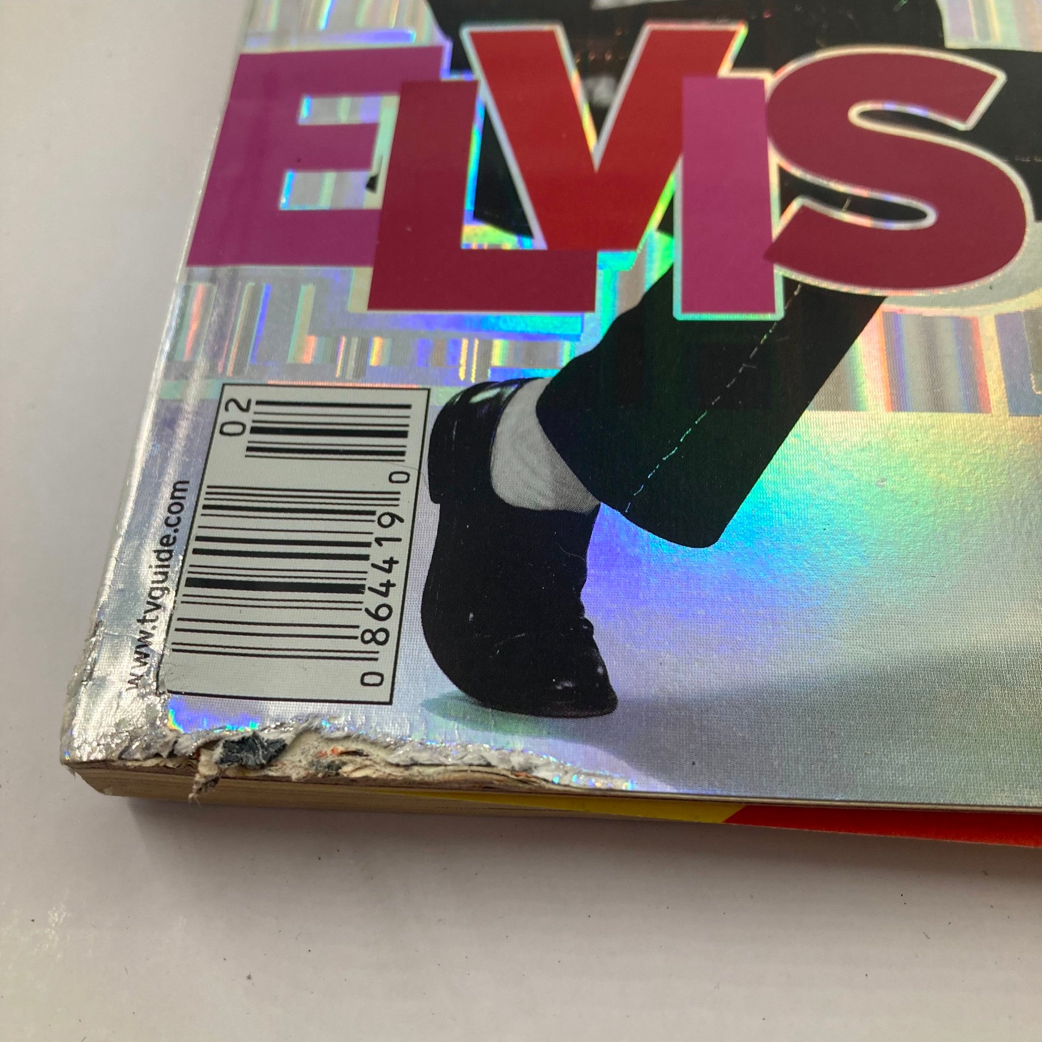 Close-up view of the damaged corner of the January 13, 2001 TV Guide Magazine featuring Elvis Presley, showing wear and tear.