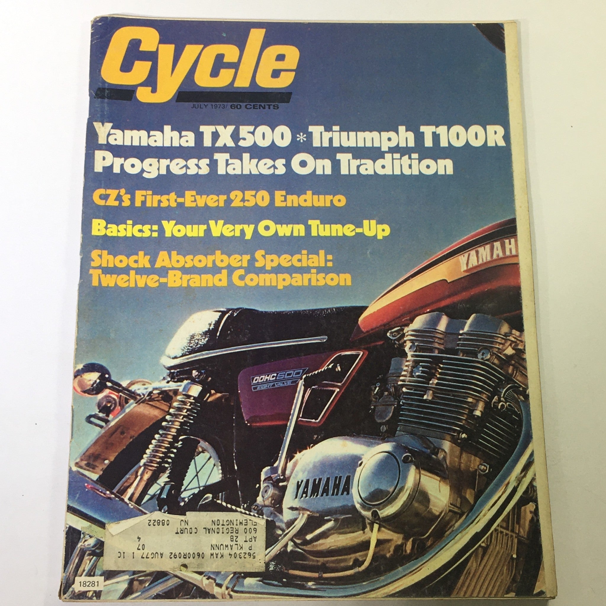Cover of VTG Cycle Magazine July 1973 featuring Yamaha TX500 and Triumph T100R with headlines about motorcycle advancements and a special focus on tuning and shock absorbers.