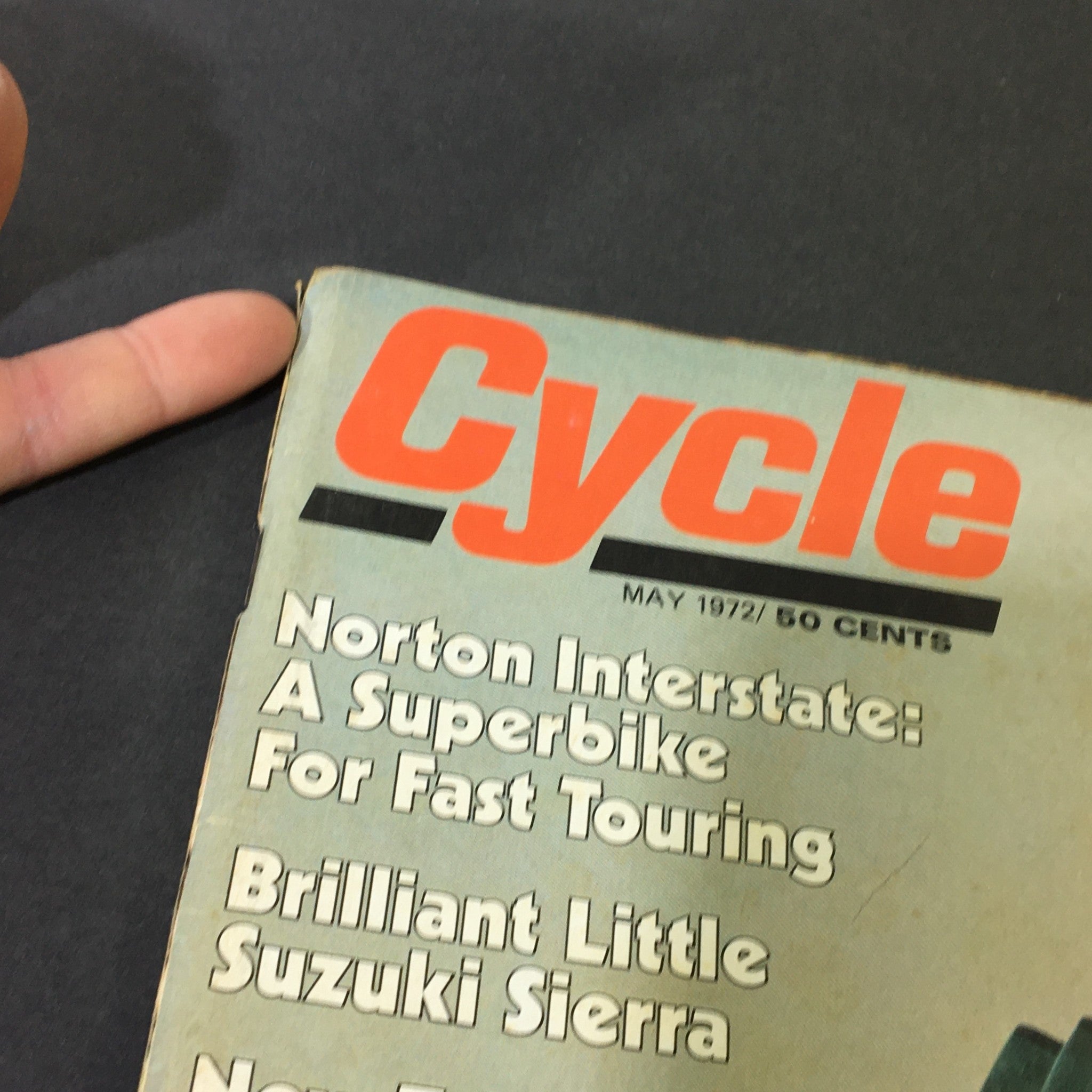 Close-up view of the cover of VTG Cycle Magazine May 1972, highlighting the title and articles on Norton Interstate and Suzuki Sierra motorcycles.