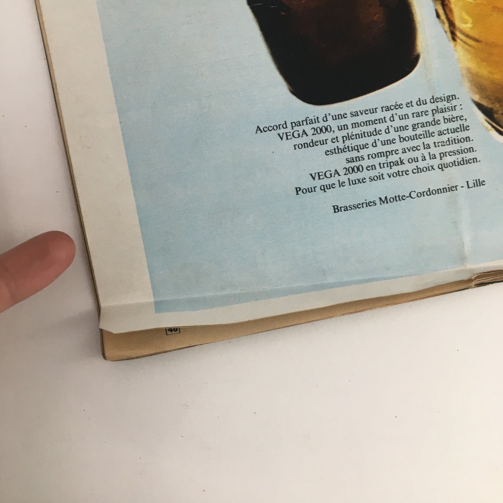 Advertisement page in Paris Match Magazine October 1972 showcasing beer branding and design.