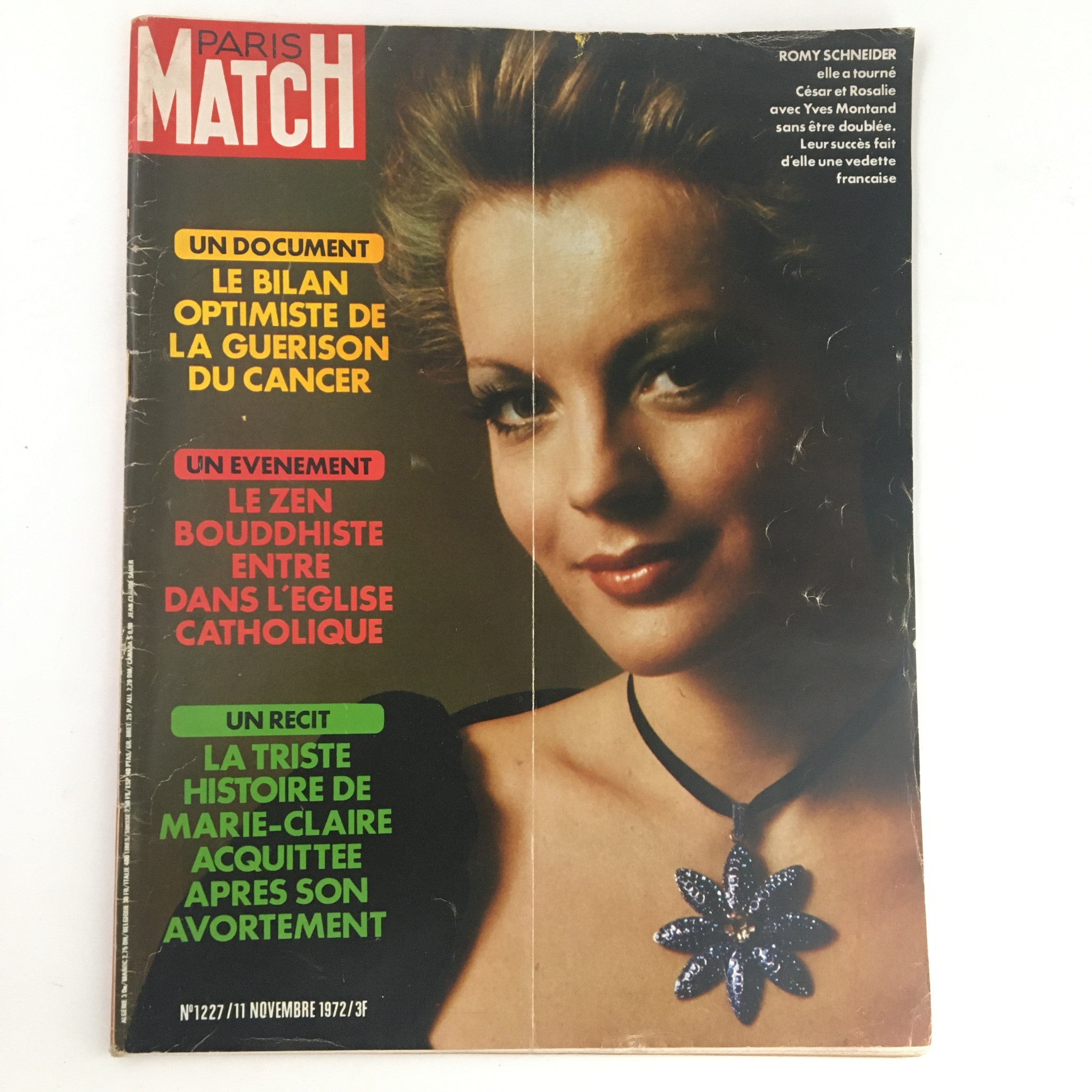 Cover of Paris Match Magazine from November 1972 featuring German actress Romy Schneider. The magazine discusses various topics, including cancer treatment optimism and Buddhist Zen events. Minor wear is visible on the magazine.