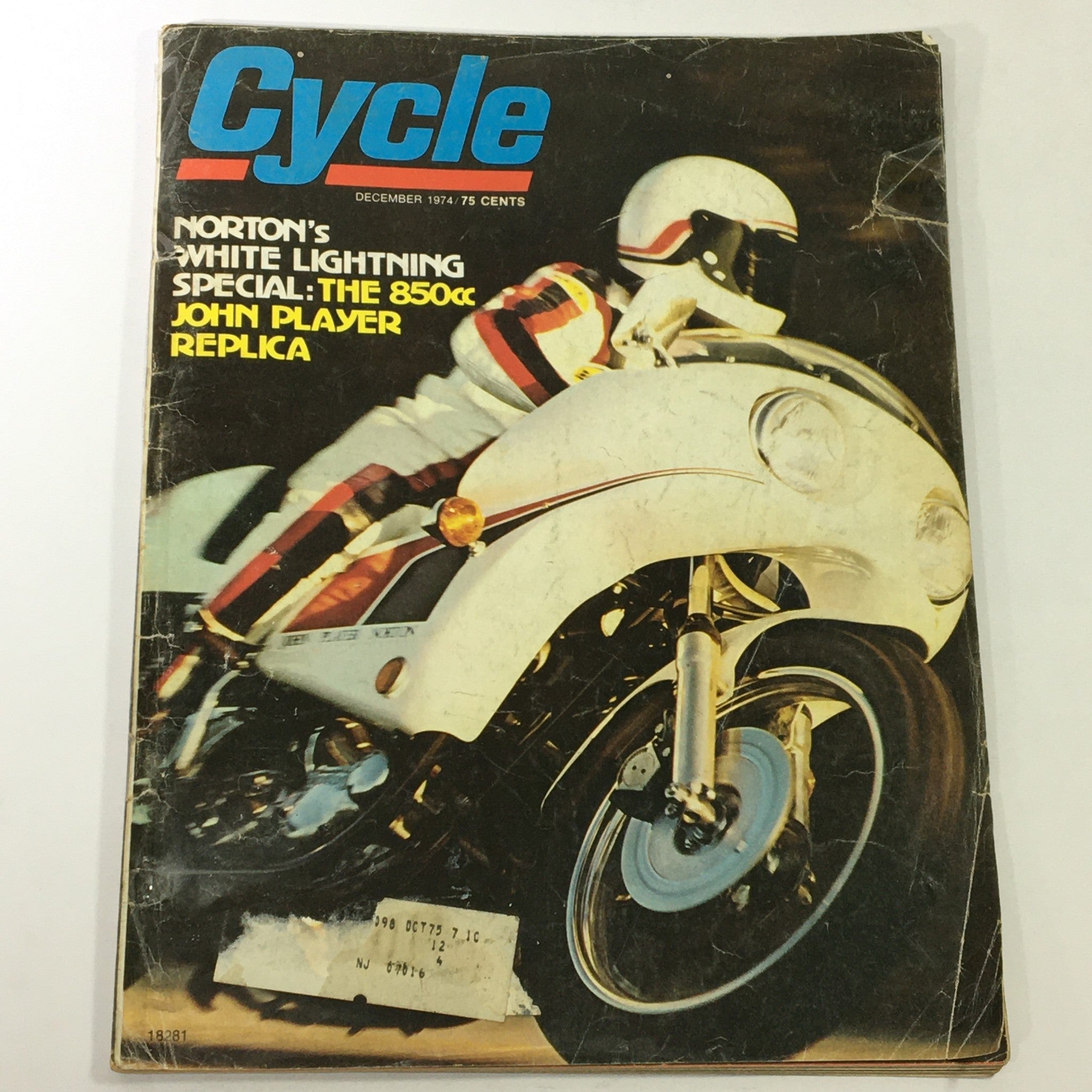 Cover of VTG Cycle Magazine December 1974 featuring Norton White Lightning 850cc John Player, showcasing dynamic motorcycle action.