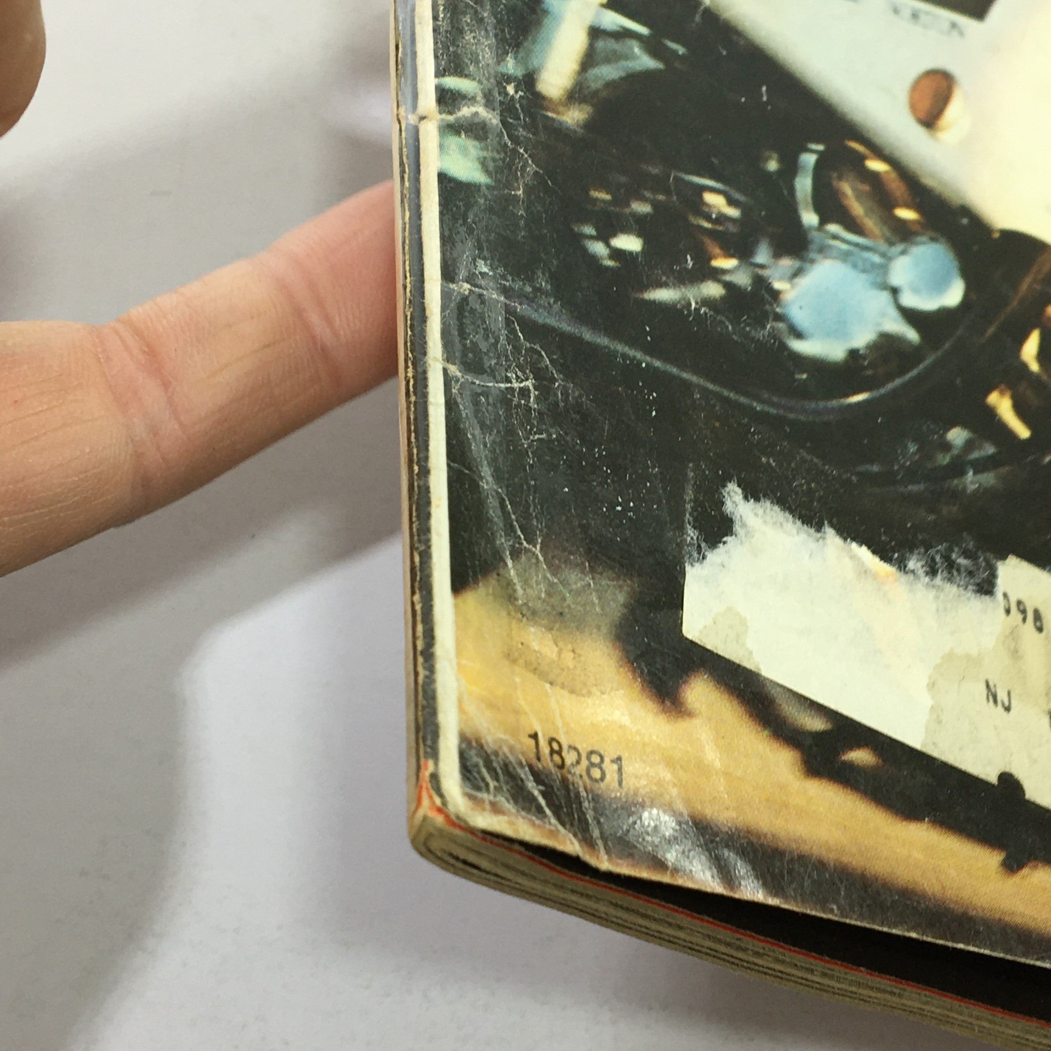 Close-up view of the spine of VTG Cycle Magazine December 1974, highlighting vintage wear and address label, making it a collectible item.