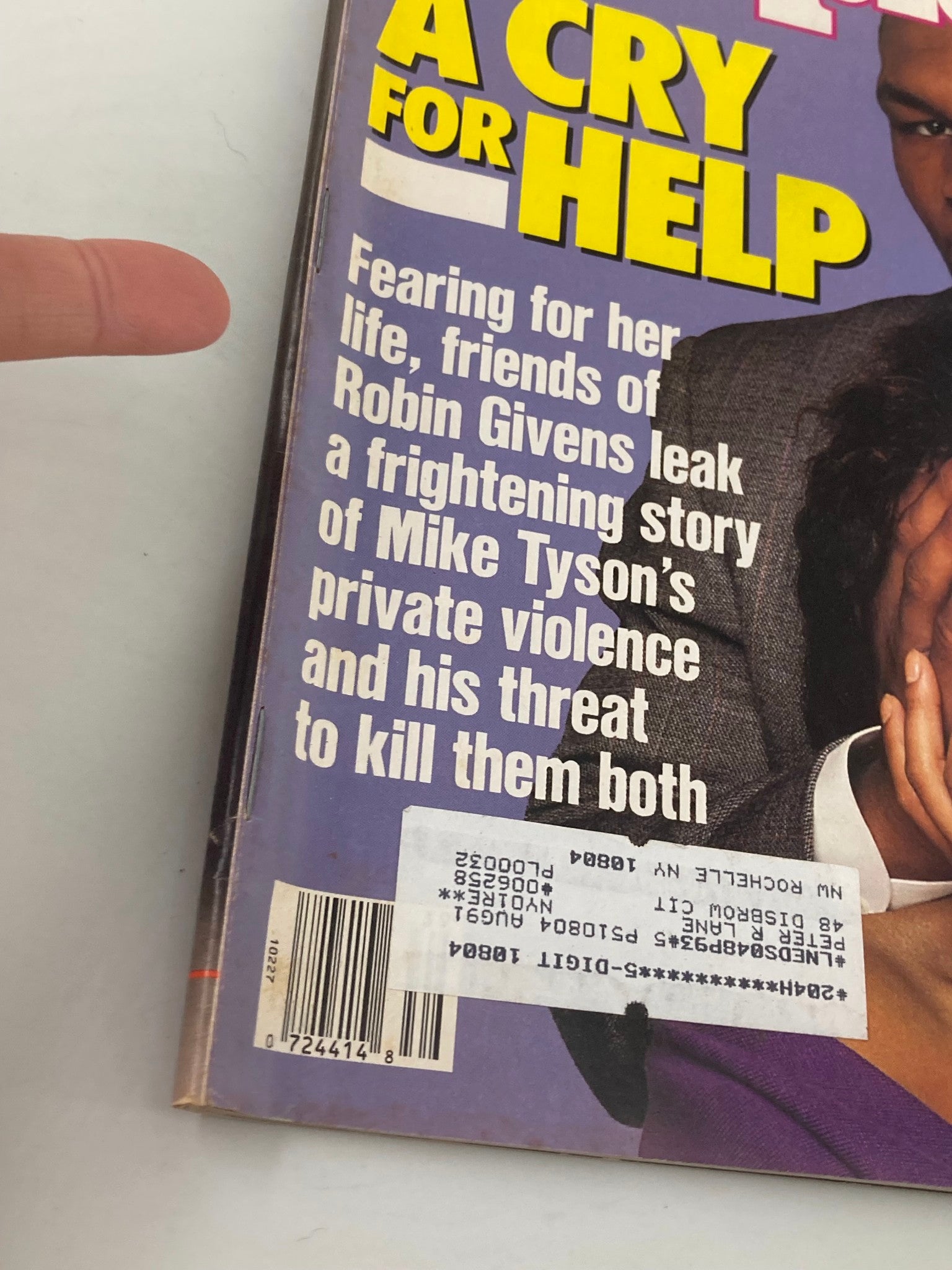 Close-up of the September 26, 1988 issue of People Weekly magazine featuring a cover story titled 'A Cry for Help' about Mike Tyson and Robin Givens, highlighting a serious narrative regarding Tyson's private violence. The magazine also has identifiable elements such as a barcode and price label.