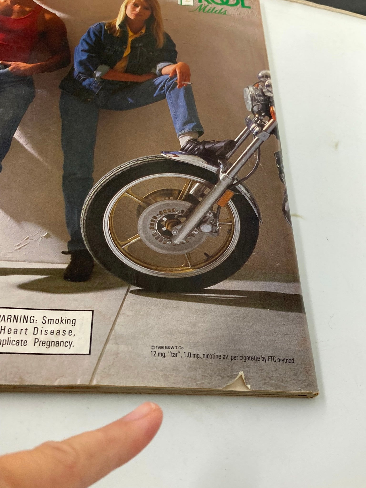 Back cover of the vintage People Weekly Magazine from November 10, 1986, showcasing a motorcycle with a woman in denim and a casual pose. This collectible magazine captures the essence of 1980s pop culture history.
