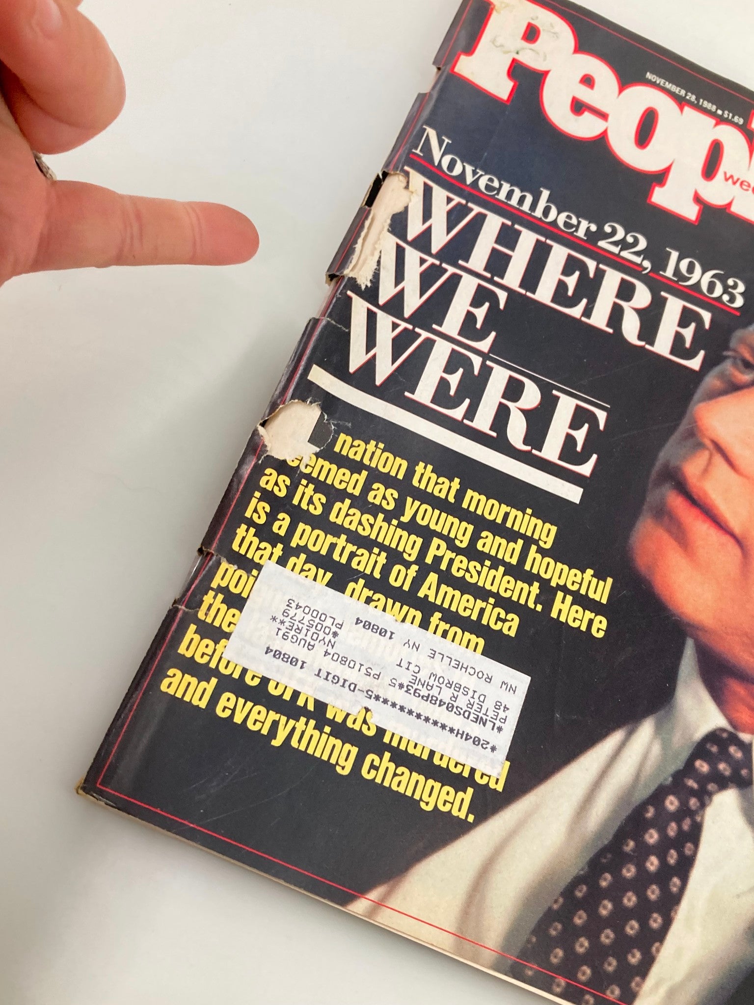 Close-up of the vintage People Weekly Magazine from November 28, 1988 featuring President John F. Kennedy on the cover, showing signs of wear including creased edges.