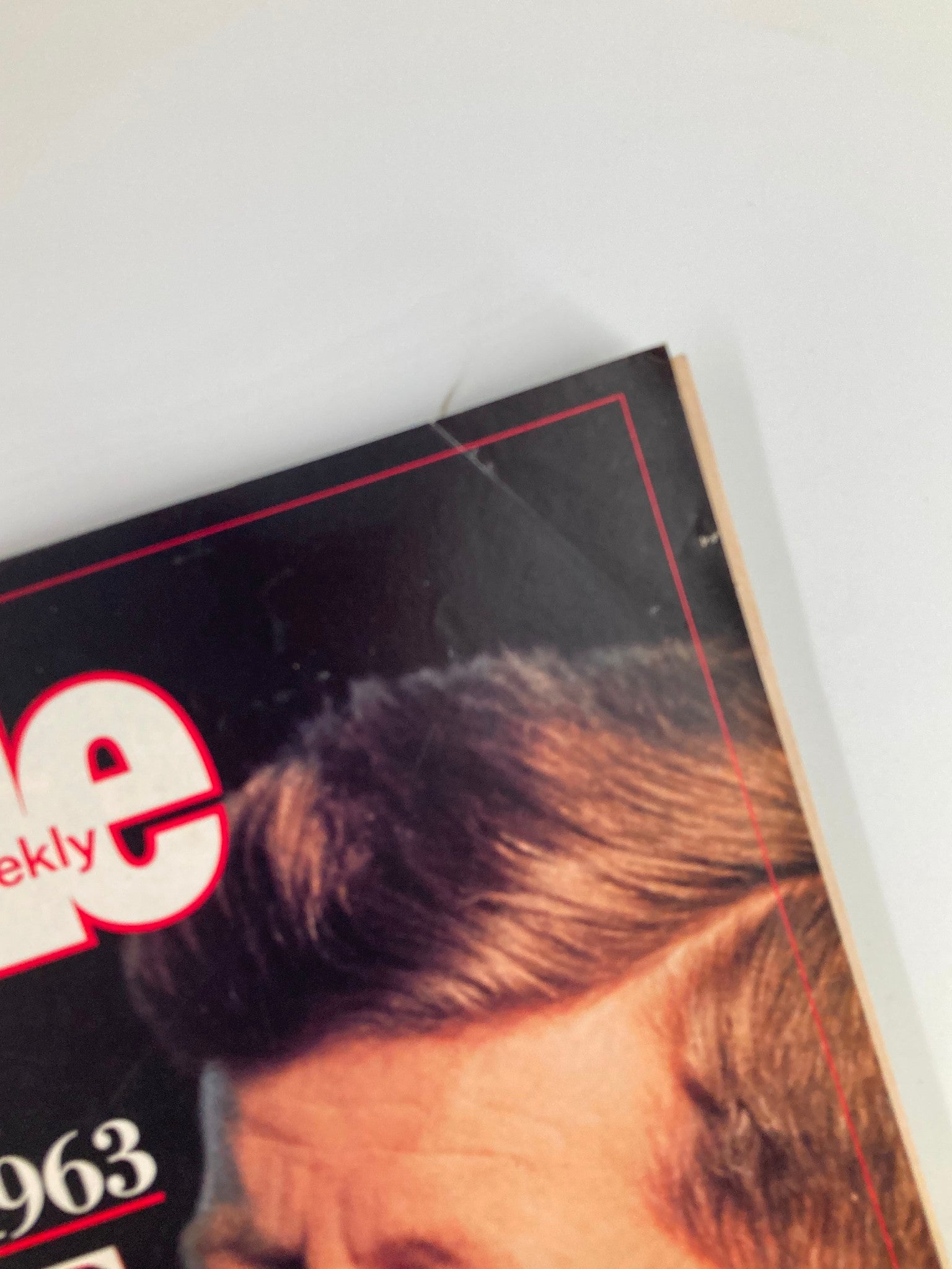 Detail view of the vintage People Weekly Magazine from November 28, 1988 featuring President John F. Kennedy, highlighting the damaged corner and condition of the cover.