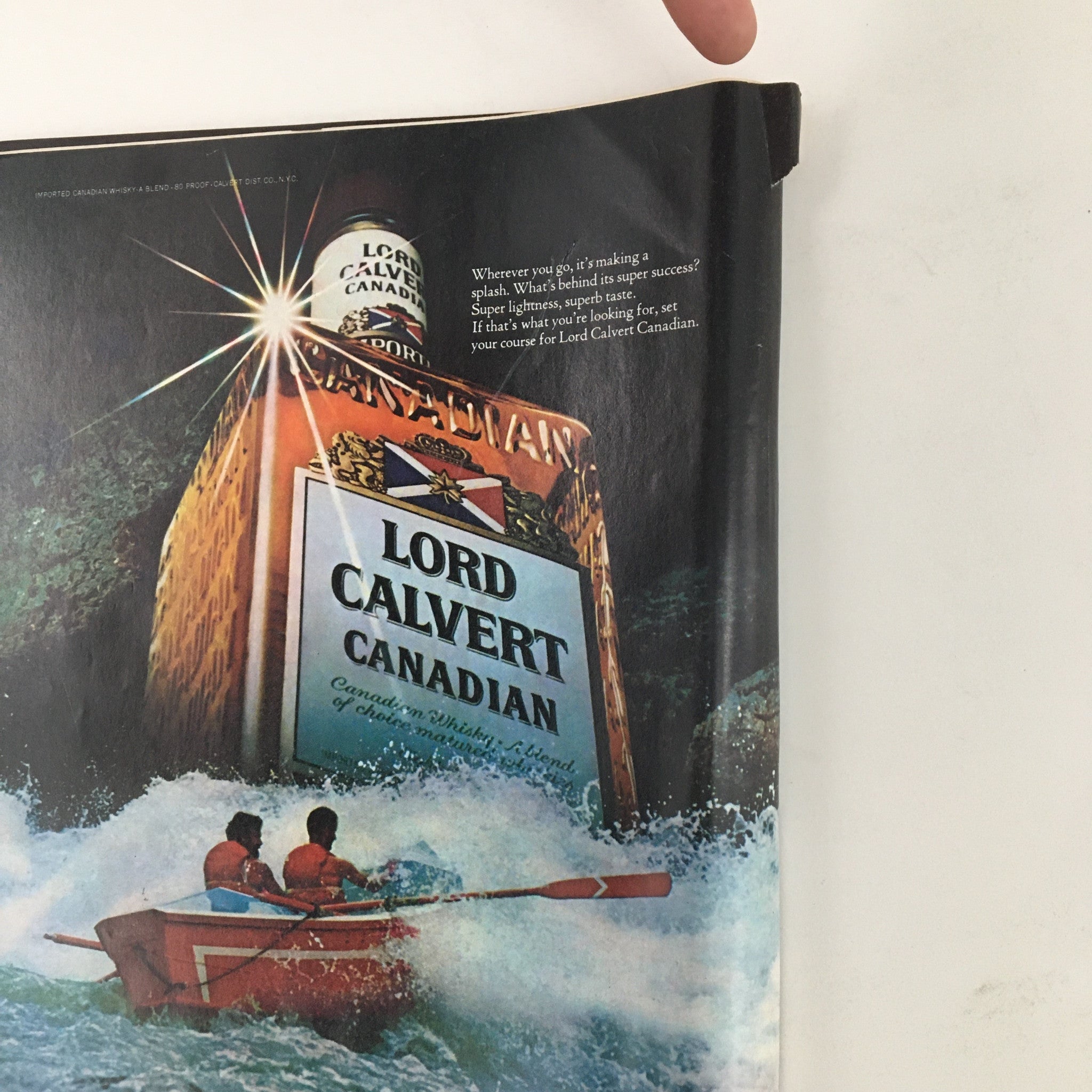 Cover of Newsweek Magazine from April 24, 1978, featuring an advertisement for Lord Calvert Canadian whisky, depicting two rowers in a boat amidst ocean waves, surrounded by the vibrant packaging of the product.