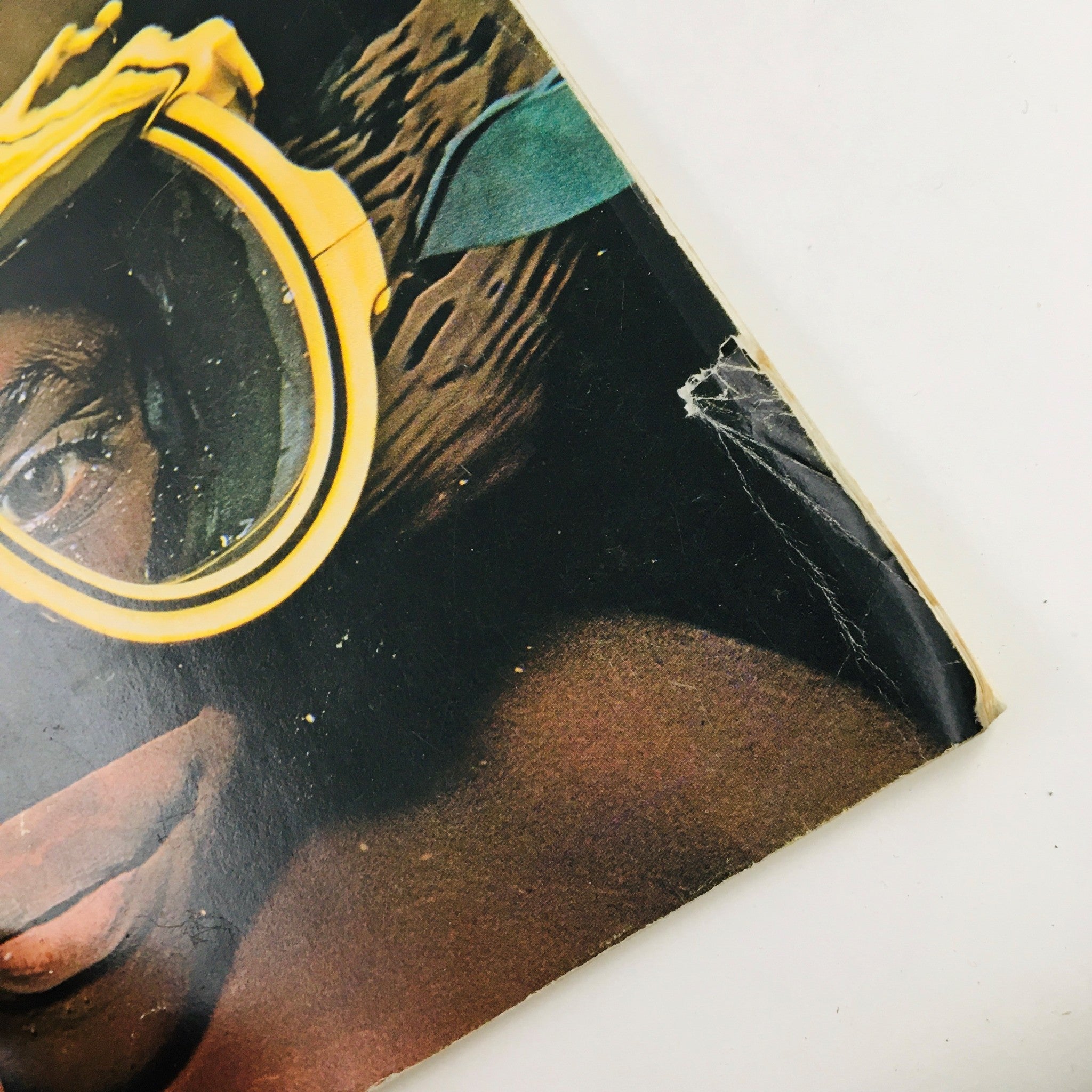 Close-up of the diver's face on the cover of Oceans Magazine November 1978 Vol 11 No. 6, showcasing the yellow snorkel mask and water reflections.