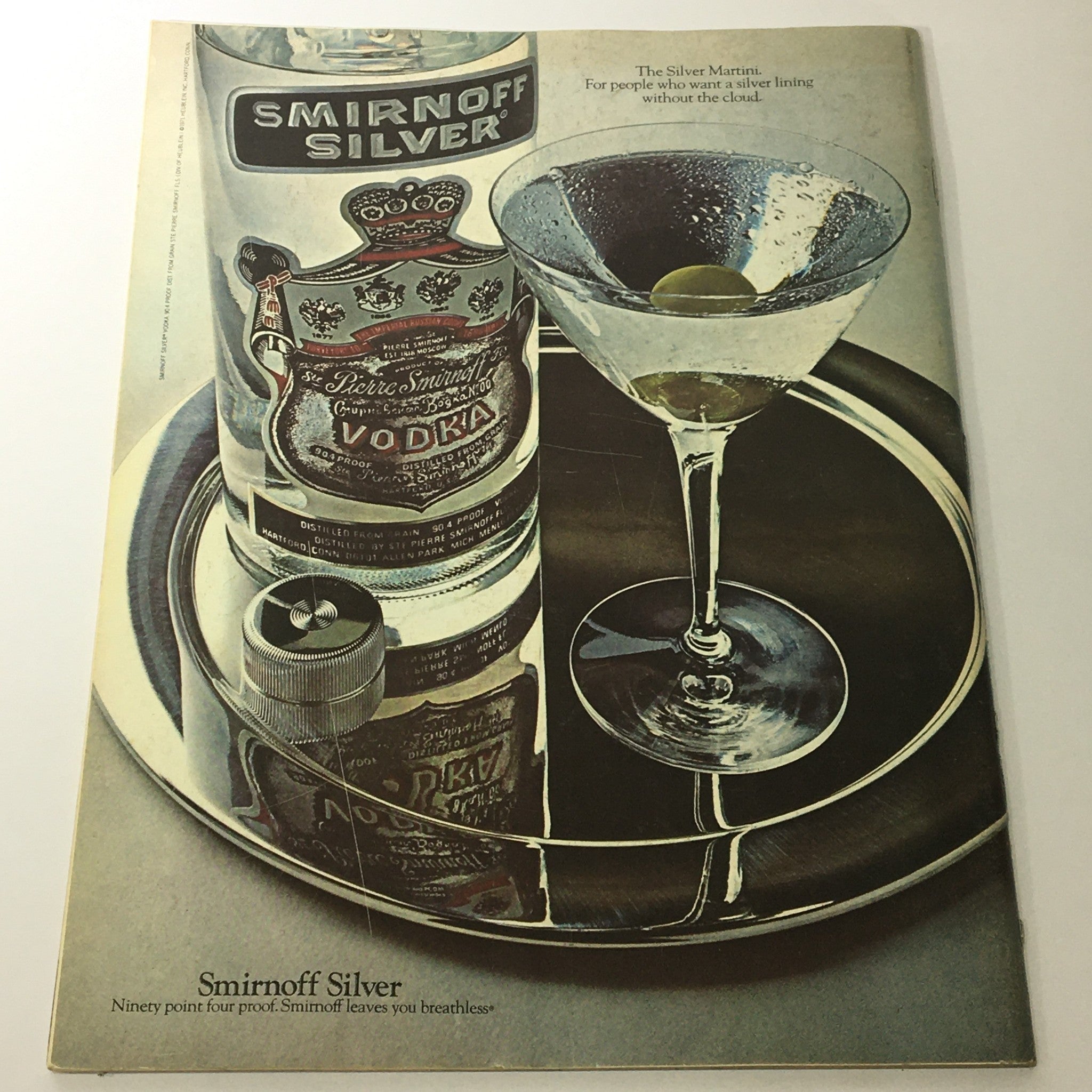 Vintage advertisement for Smirnoff Silver Vodka featuring a martini glass with an olive, showcasing the tagline 'The Silver Martini. For people who want a silver lining without the cloud.' This image connects to the VTG Gourmet Magazine from August 1972.