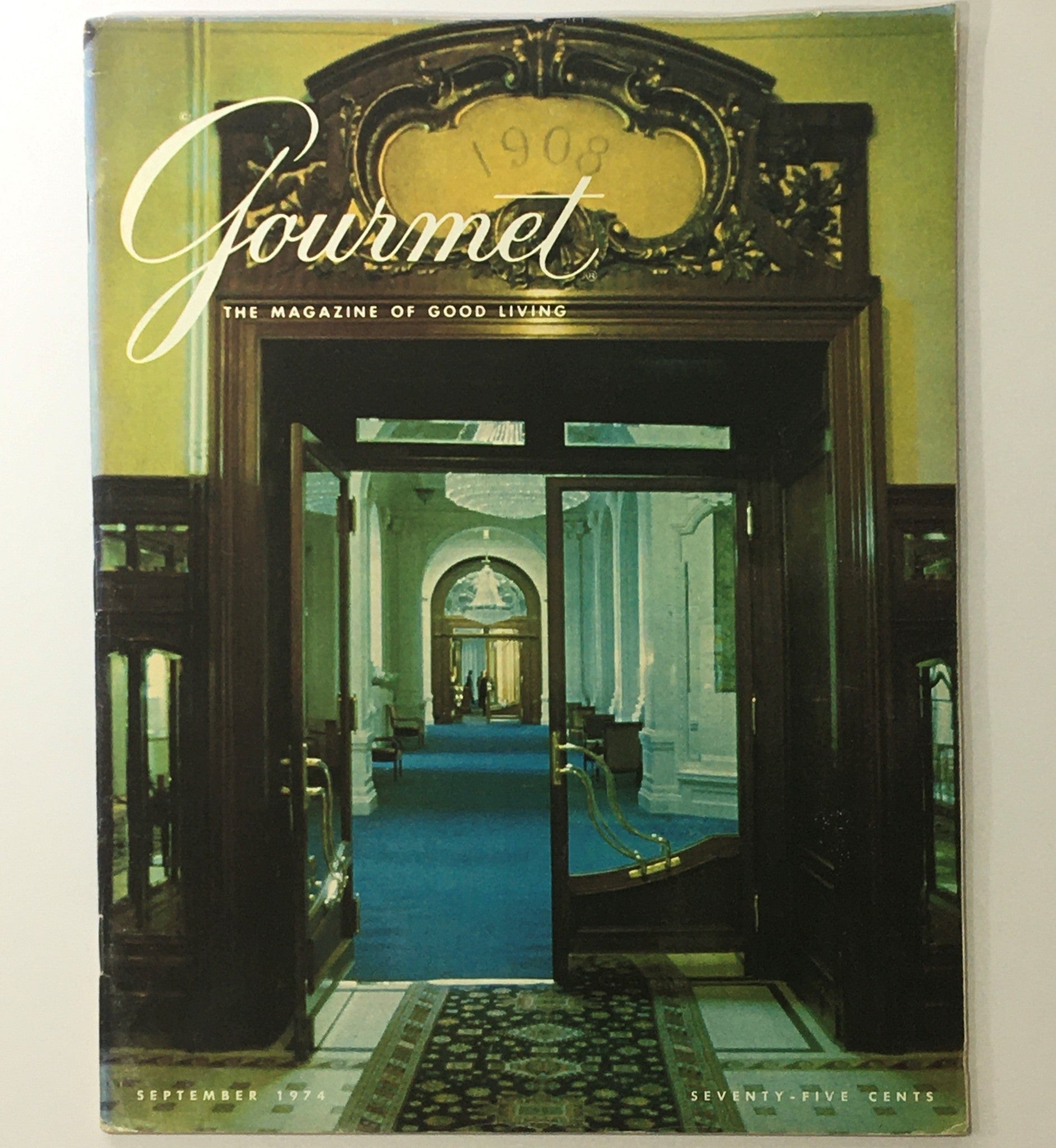 Cover of VTG Gourmet The Magazine of Good Living, September 1974, titled 'The Illustrious Avocado', featuring an elegant interior doorway and blue carpet.