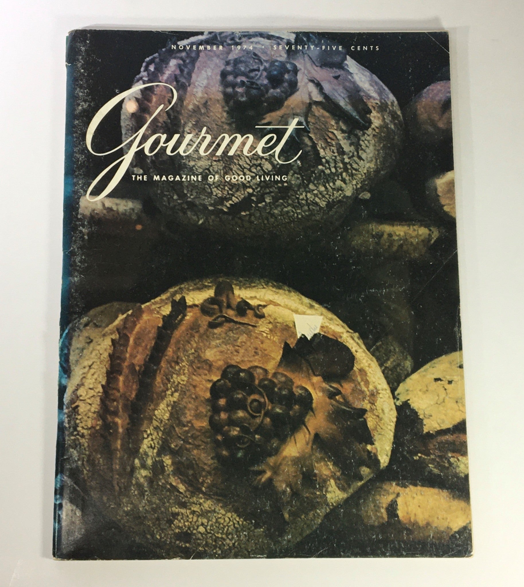 Cover of VTG Gourmet The Magazine of Good Living November 1974 featuring a vintage artistic depiction of bread and grapes, capturing the essence of Italian culinary artistry.