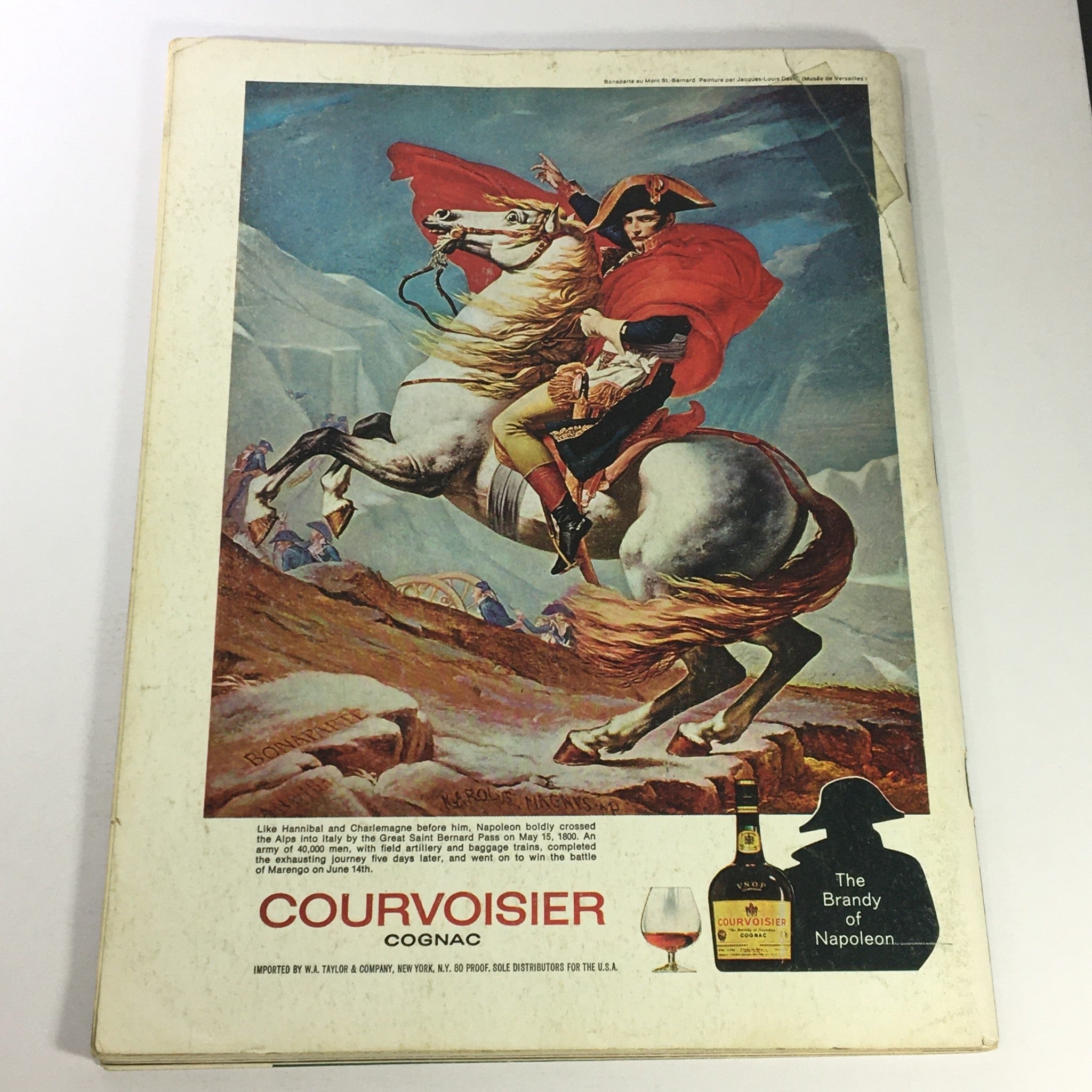 Back cover of VTG Gourmet The Magazine of Good Living November 1974 showcasing a vibrant advertisement for Courvoisier Cognac, featuring Napoleon on horseback.
