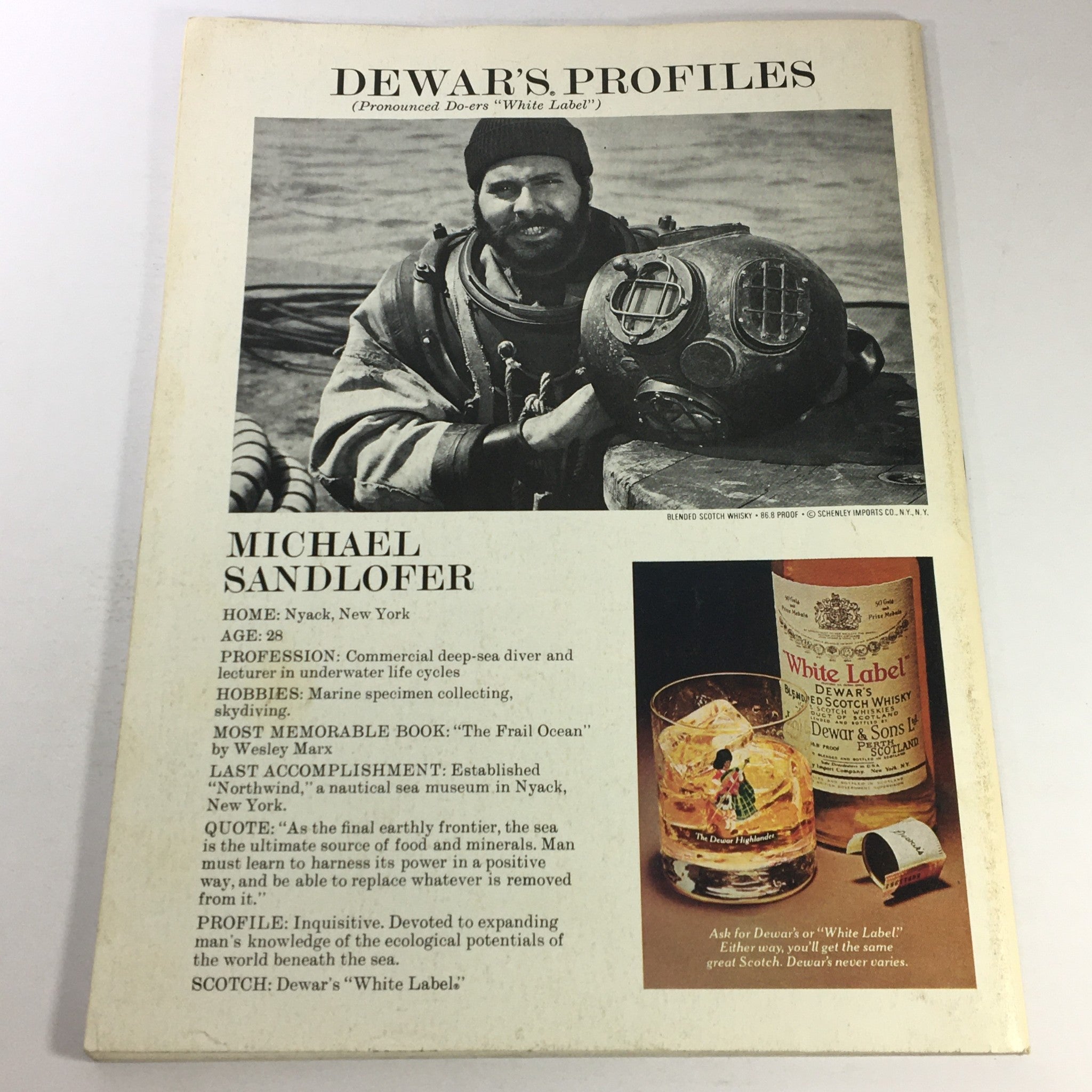 Back cover of VTG Gourmet The Magazine of Good Living January 1977, featuring a profile of marine expert Michael Sandlofer alongside Dewar's whisky advertisement.