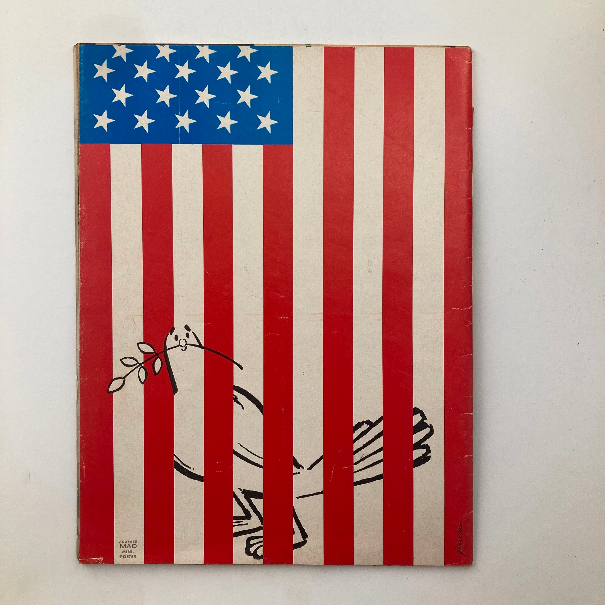 Back cover of Mad Magazine June 1972 No. 151 featuring a creative illustration of a bird holding an olive branch against a backdrop of the American flag.