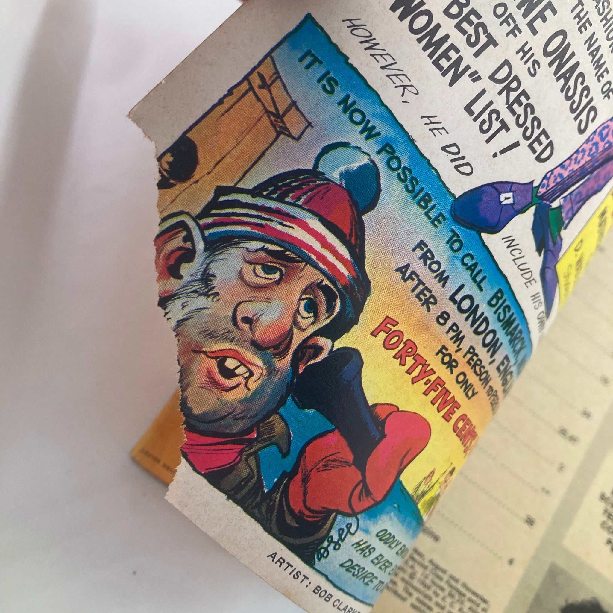An interior page from Mad Magazine January 1970 No. 132, showcasing a humorous caricature of a man in a colorful winter hat and mittens, highlighting the magazine's ironic and satirical artwork.
