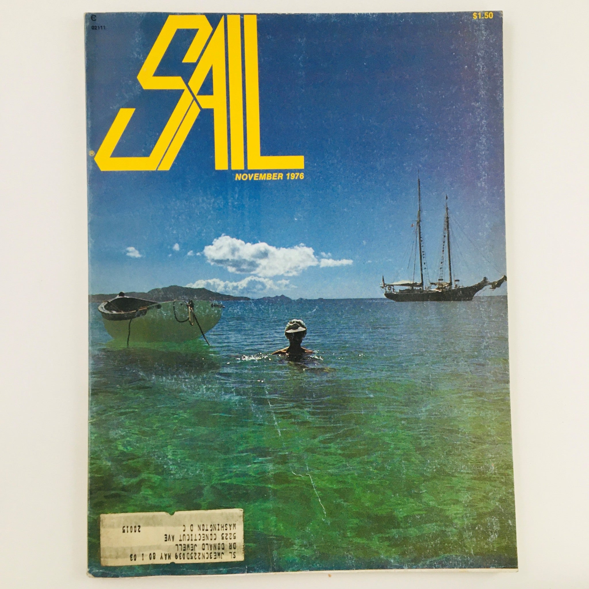 Cover of Sail Magazine, November 1976, featuring the Murray Peterson-designed schooner Defiance and a scenic view of a swimmer in clear waters, highlighting the maritime lifestyle.