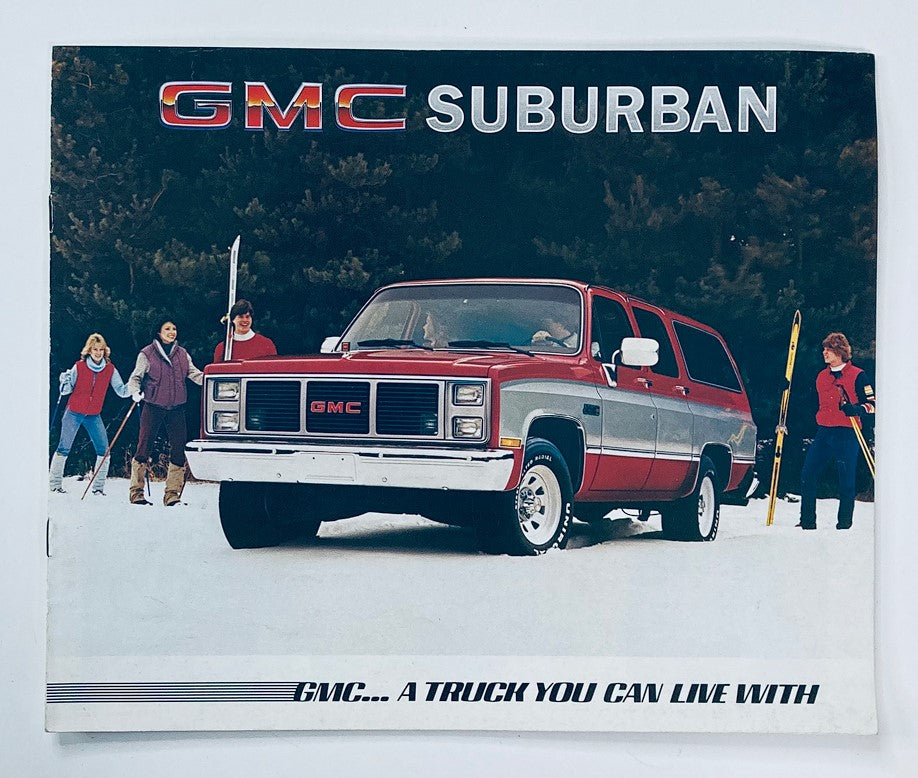 1985 GMC Truck Suburban Dealer Showroom Sales Brochure showcasing the GMC Suburban vehicle against a snowy background with people enjoying outdoor activities.