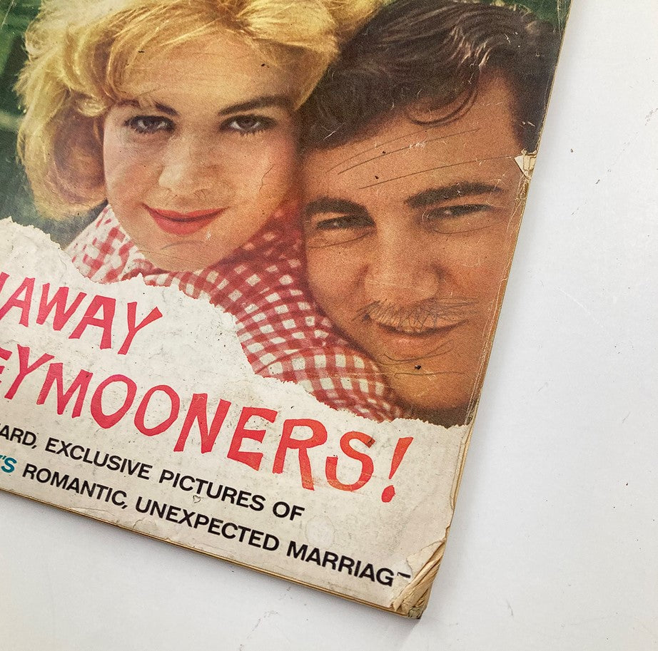 Close-up view of the cover of VTG Photoplay Magazine March 1961 showcasing Sandra Dee and Bobby Darin, featuring the title 'RUNAWAY HONEYMOONERS!' with vintage magazine details.