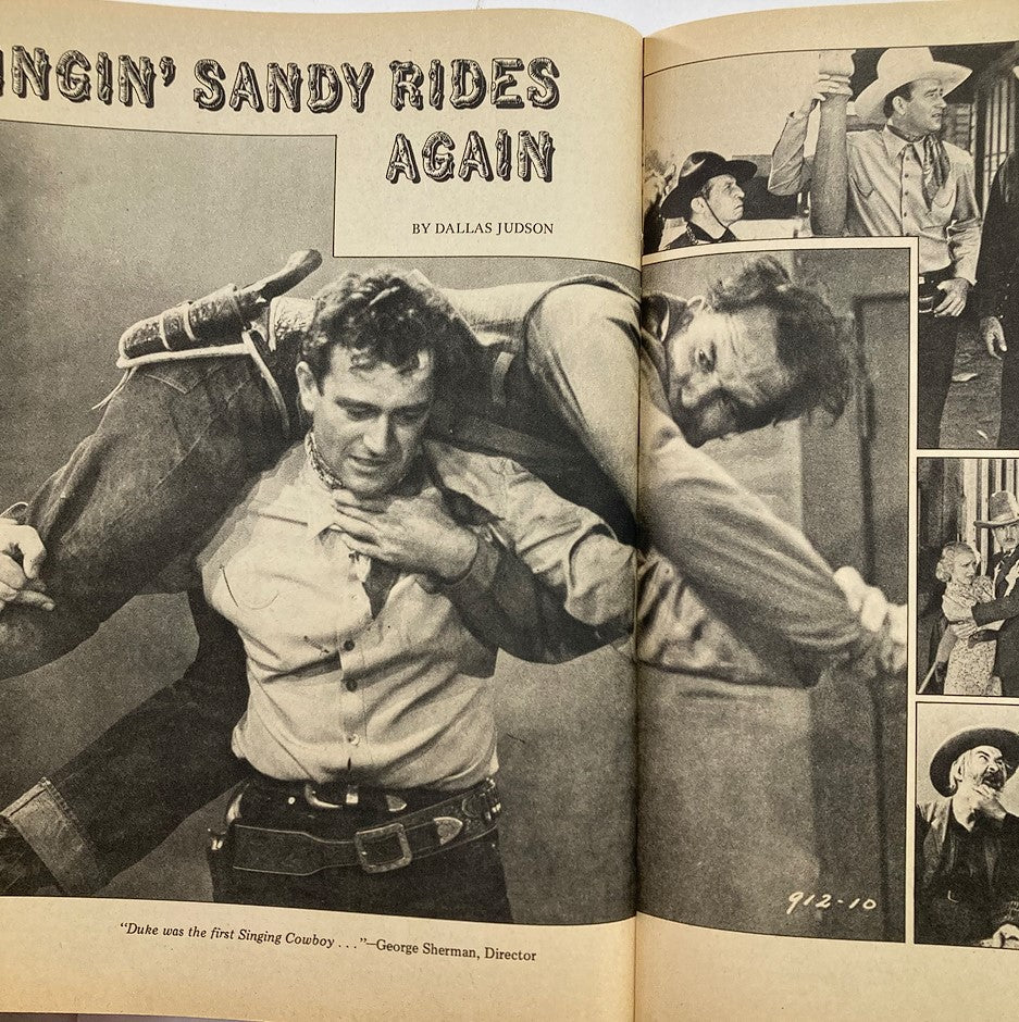 Inside page of VTG E-Go Collectors Magazine Series No. 4 September 1976 titled 'Singin' Sandy Rides Again,' featuring John Wayne in various scenes, highlighting his role as a singing cowboy.