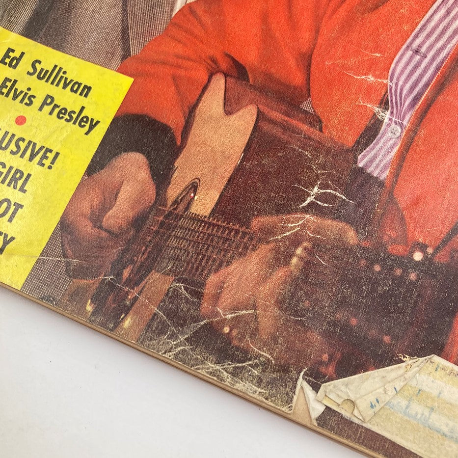 Close-up of the Vintage TV Radio Mirror Magazine December 1956, showing Ed Sullivan and Elvis Presley with a guitar, highlighting pop culture moments.