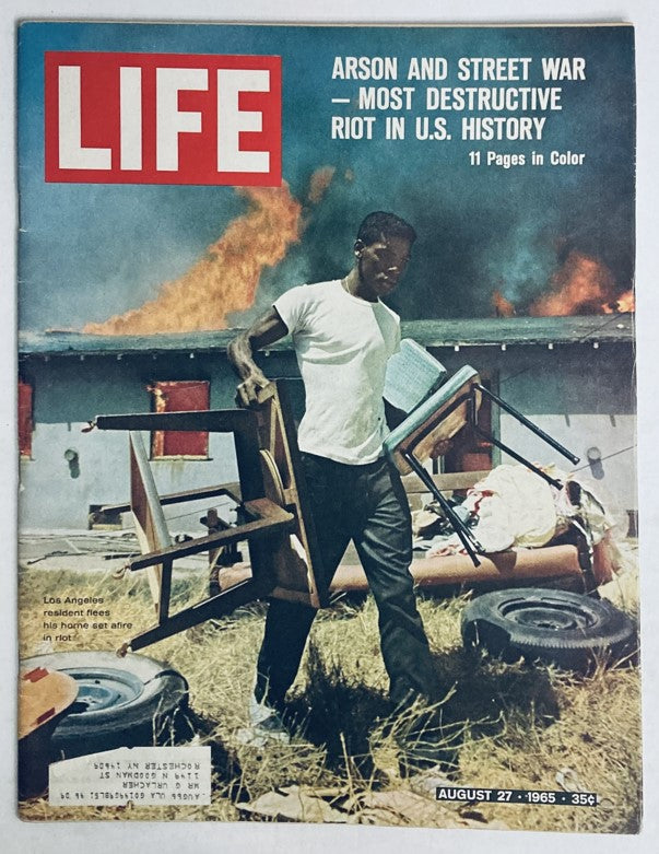 Cover of VTG Life Magazine August 27 1965 featuring an image of a man fleeing a burning building during civil unrest.