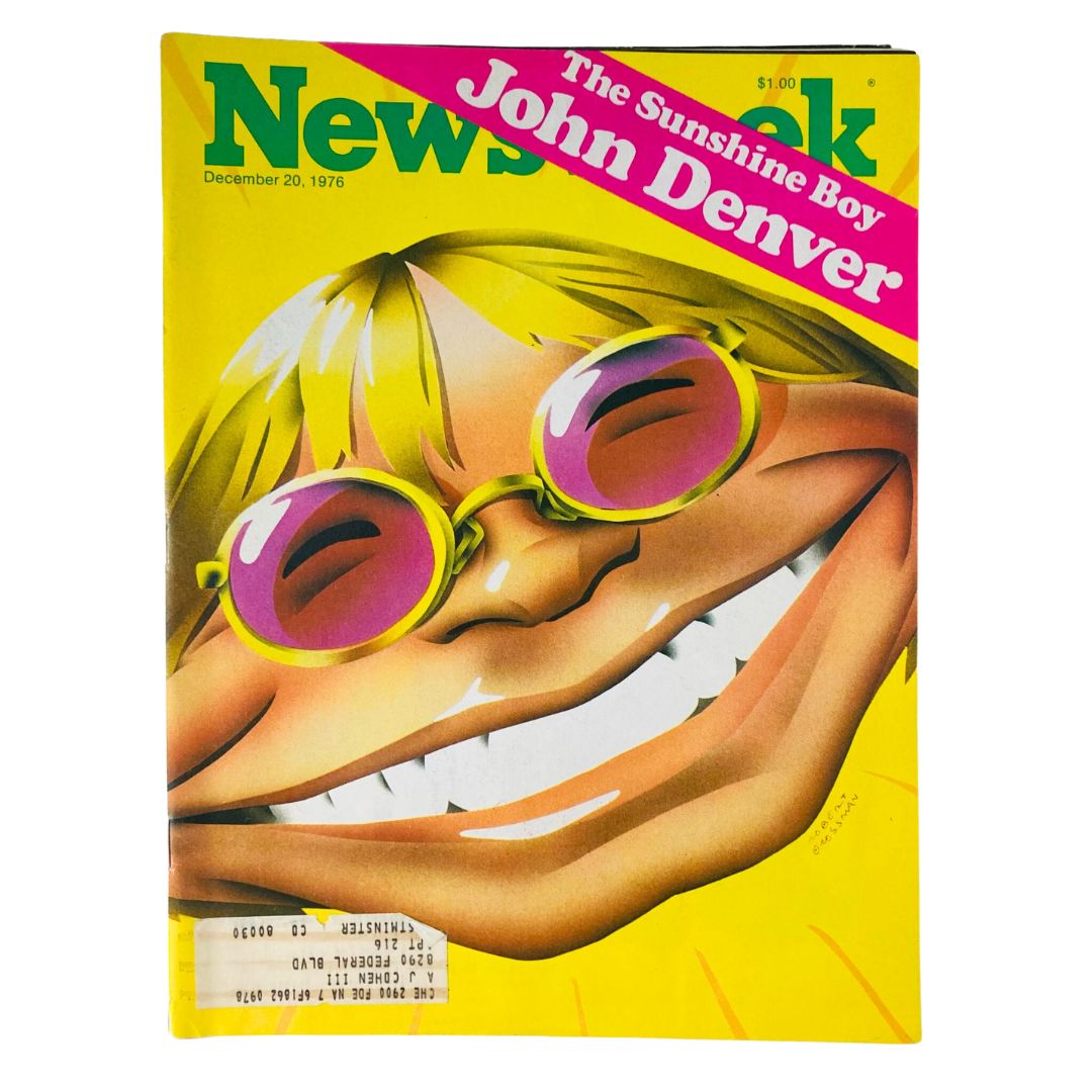 VTG Newsweek Magazine from December 20, 1976 featuring John Denver, known as 'The Sunshine Boy.' The magazine cover showcases an artistic illustration of a smiling character with sunglasses against a vibrant yellow background, capturing the essence of the 1970s pop culture.