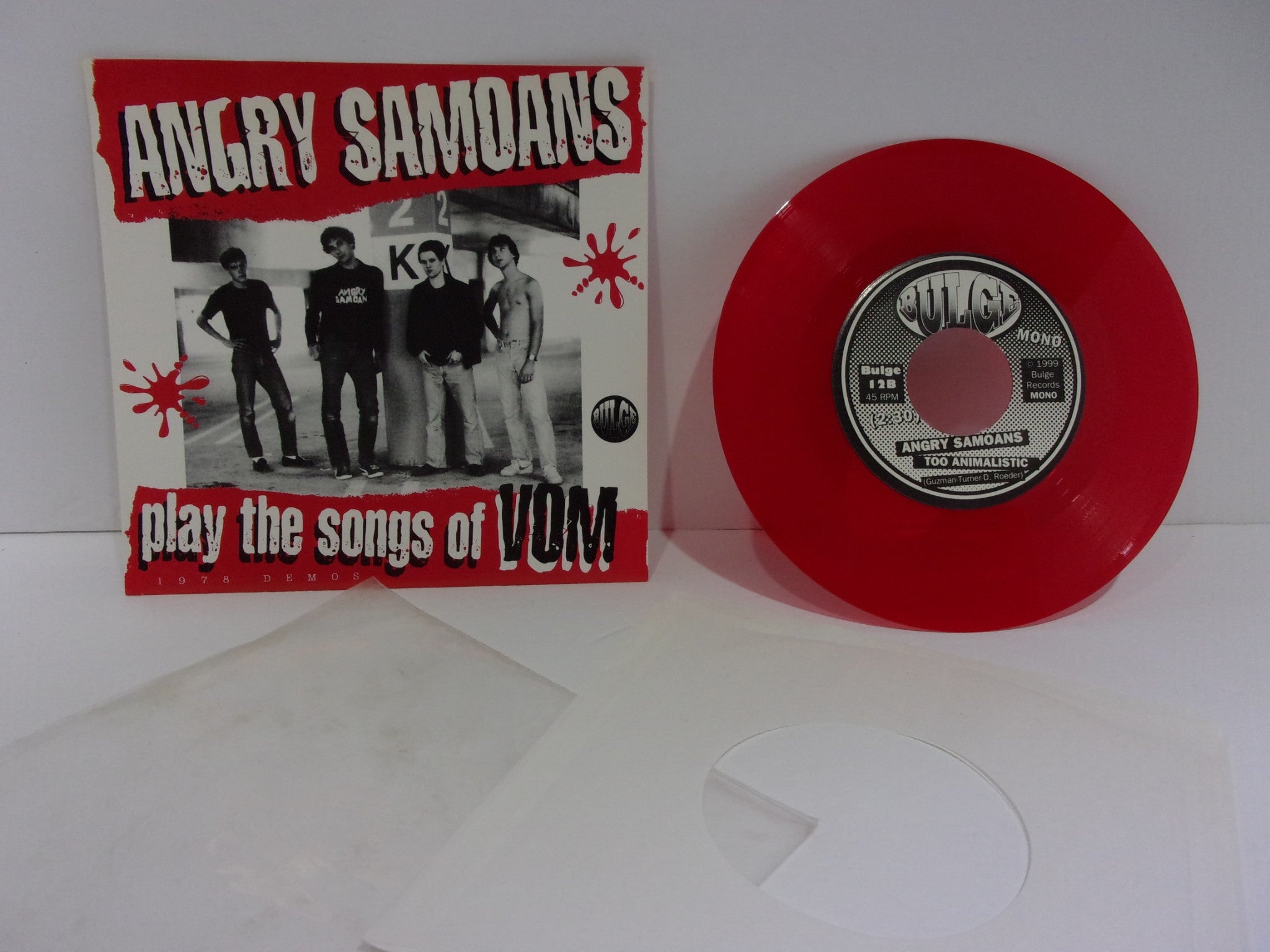 Angry Samoans: Play The Songs Of Vom Bulge Records 12 Mono Single Red Grade: VG+