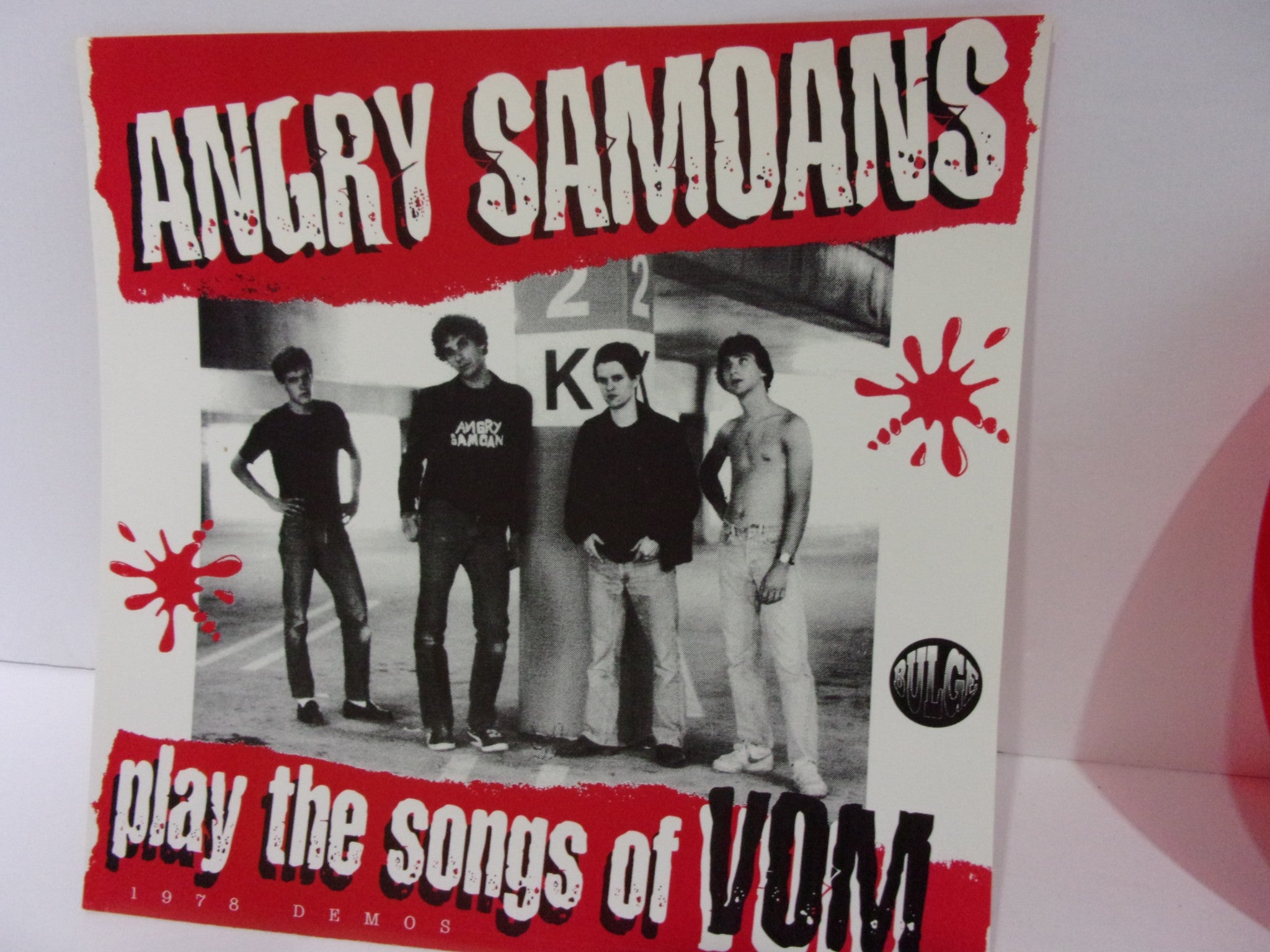 Angry Samoans: Play The Songs Of Vom Bulge Records 12 Mono Single Red Grade: VG+