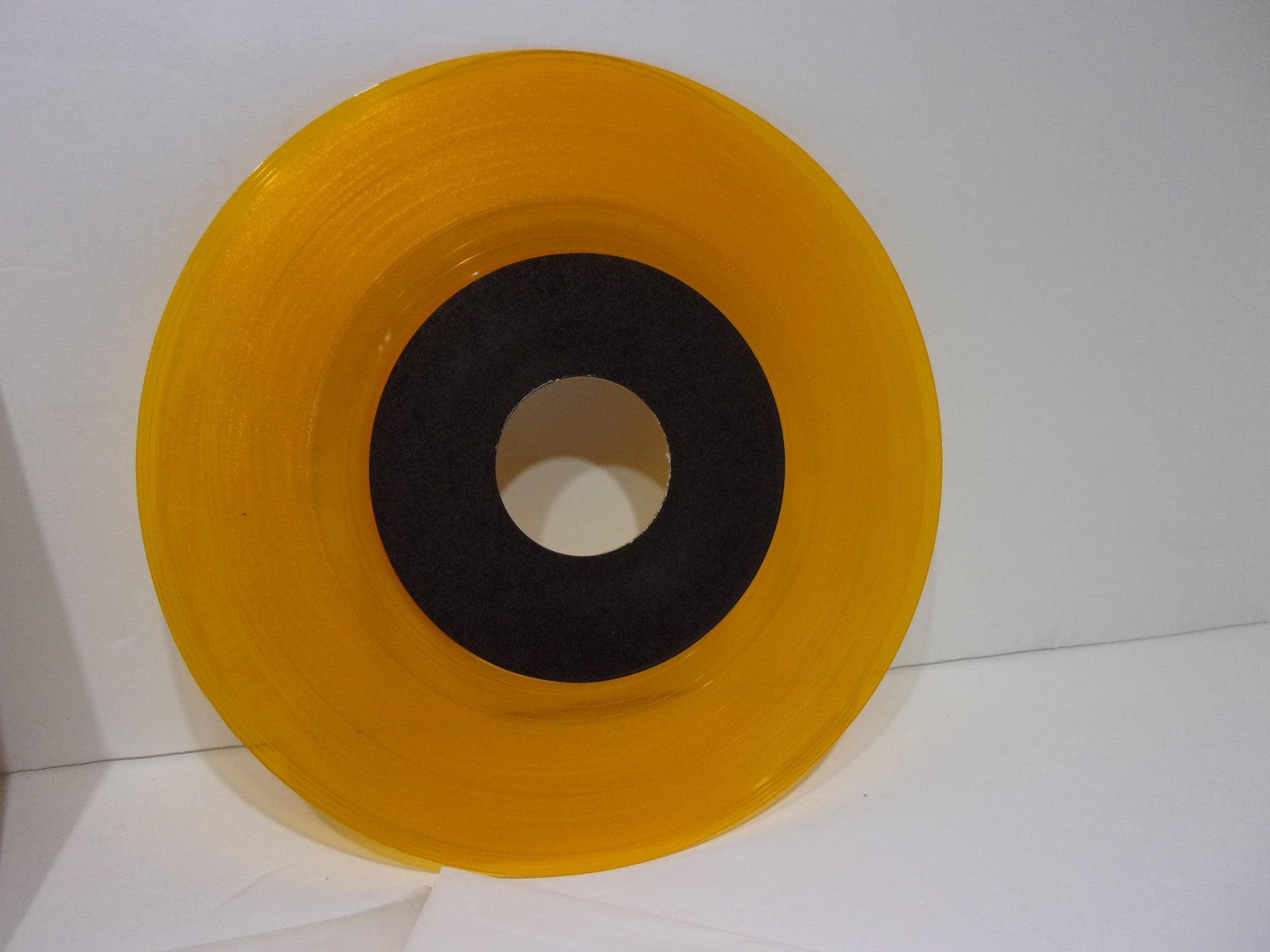 Another angle of the yellow vinyl from Straight Ahead: Spirit Of Youth EP, emphasizing its glossy finish and unique appearance.
