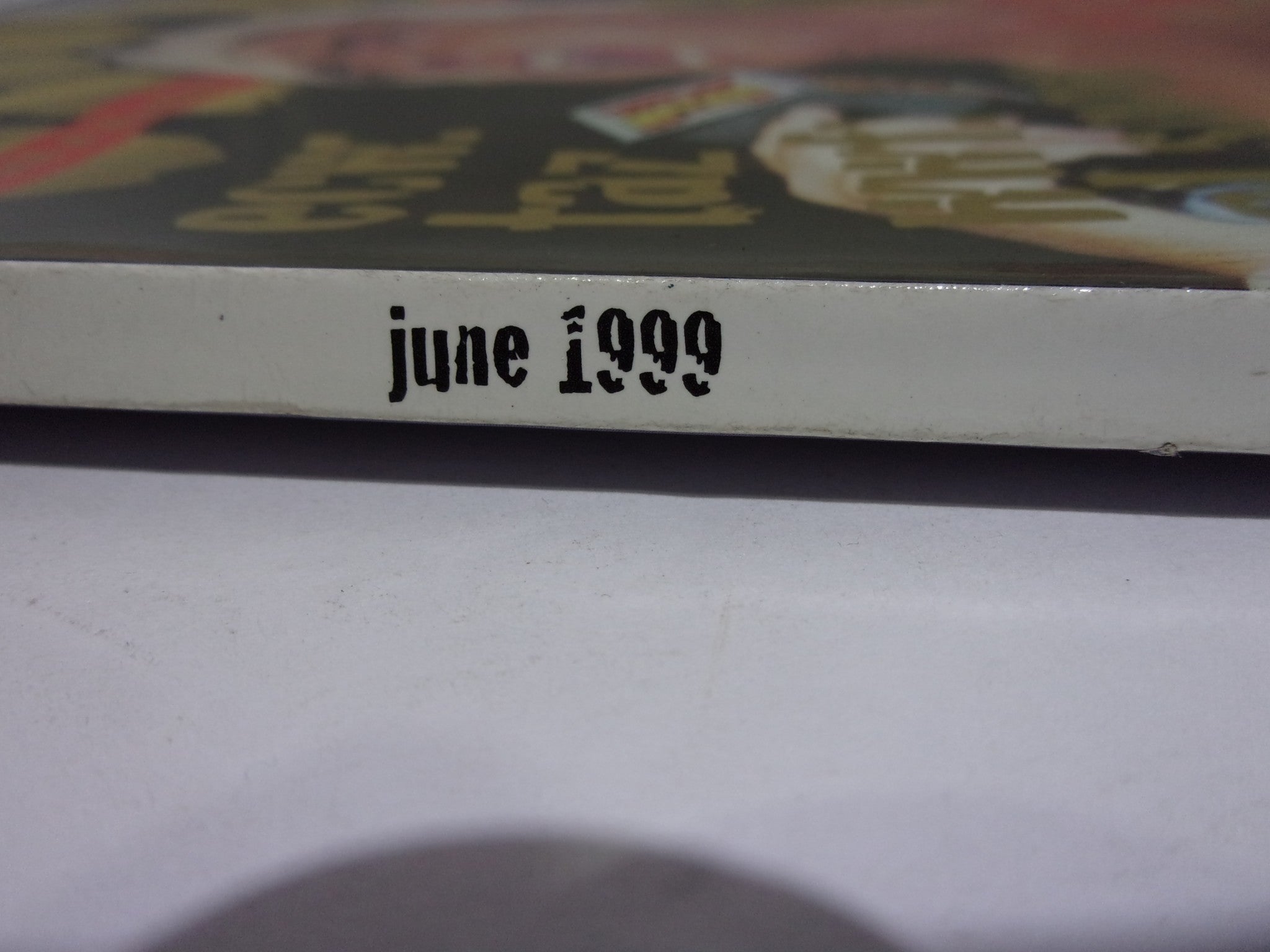 Side view image of Wow Magazine: The Best of WCW - ECW - WWF June 1999 Vol. 1 Issue 2 showing the month and year of publication, June 1999.