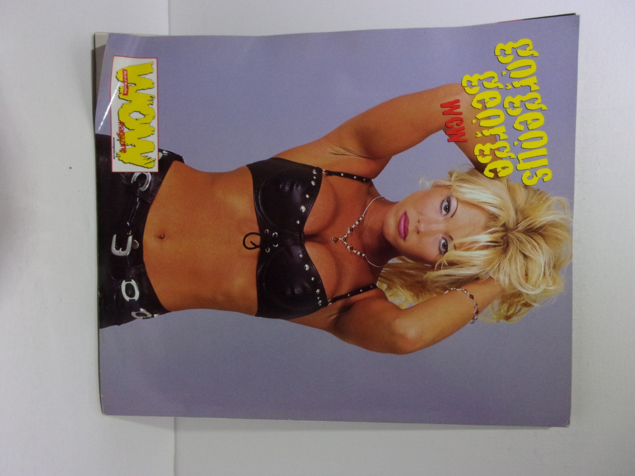 Cover image of Wow Magazine: The Best of WCW - ECW - WWF June 1999 Vol. 1 Issue 2 featuring Gorgeous George in a stylish black outfit.