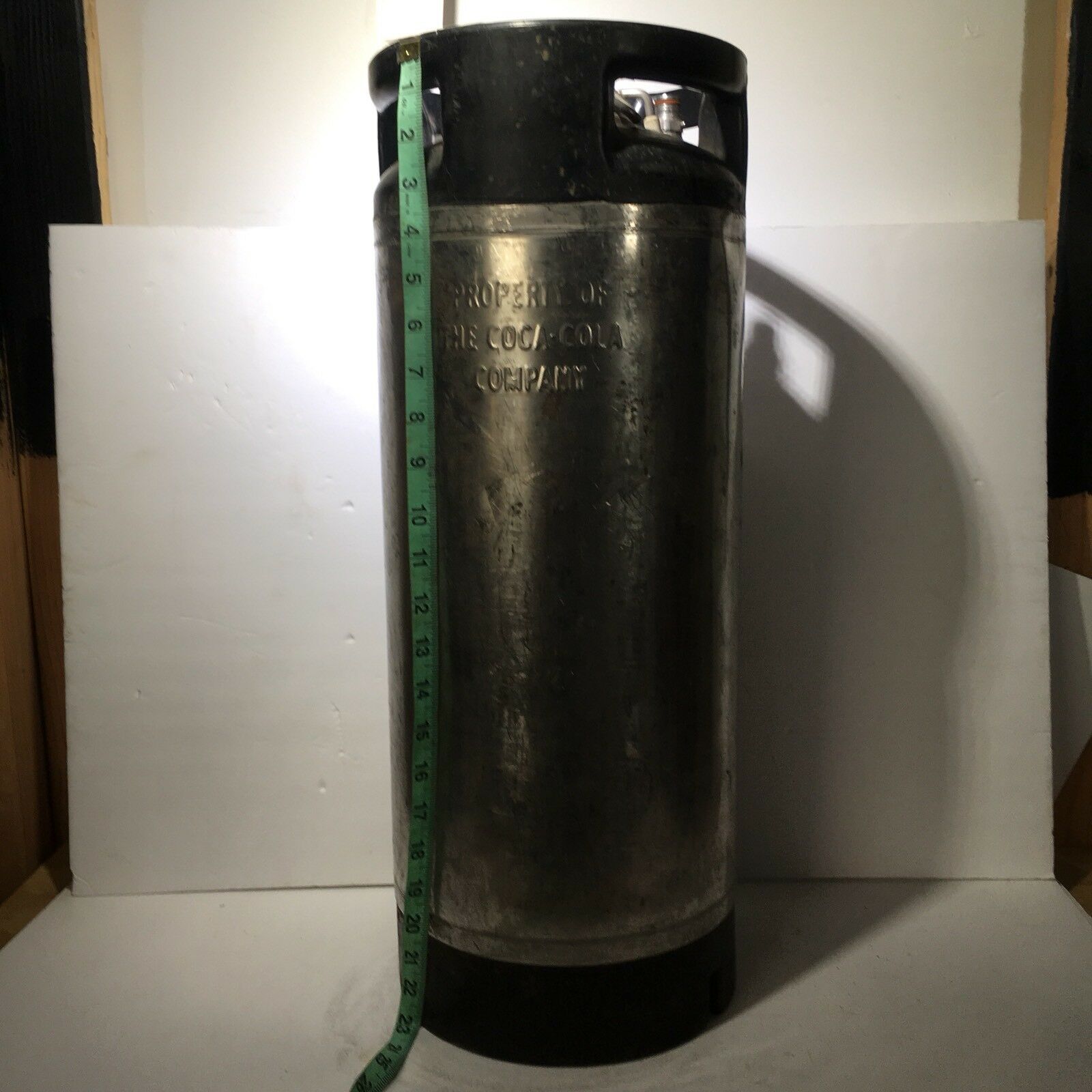 Vintage COCA COLA Keg Syrup 5 Gallon from Alloy Products USA showing front side with measuring tape for scale.