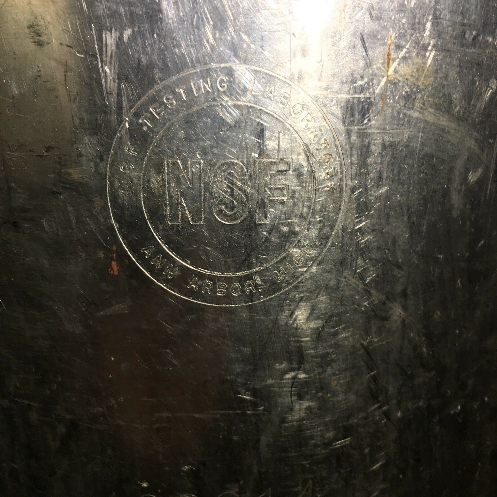 Detail of the NSF marking on the Vintage COCA COLA Keg Syrup 5 Gallon, significant for historical beverage enthusiasts.