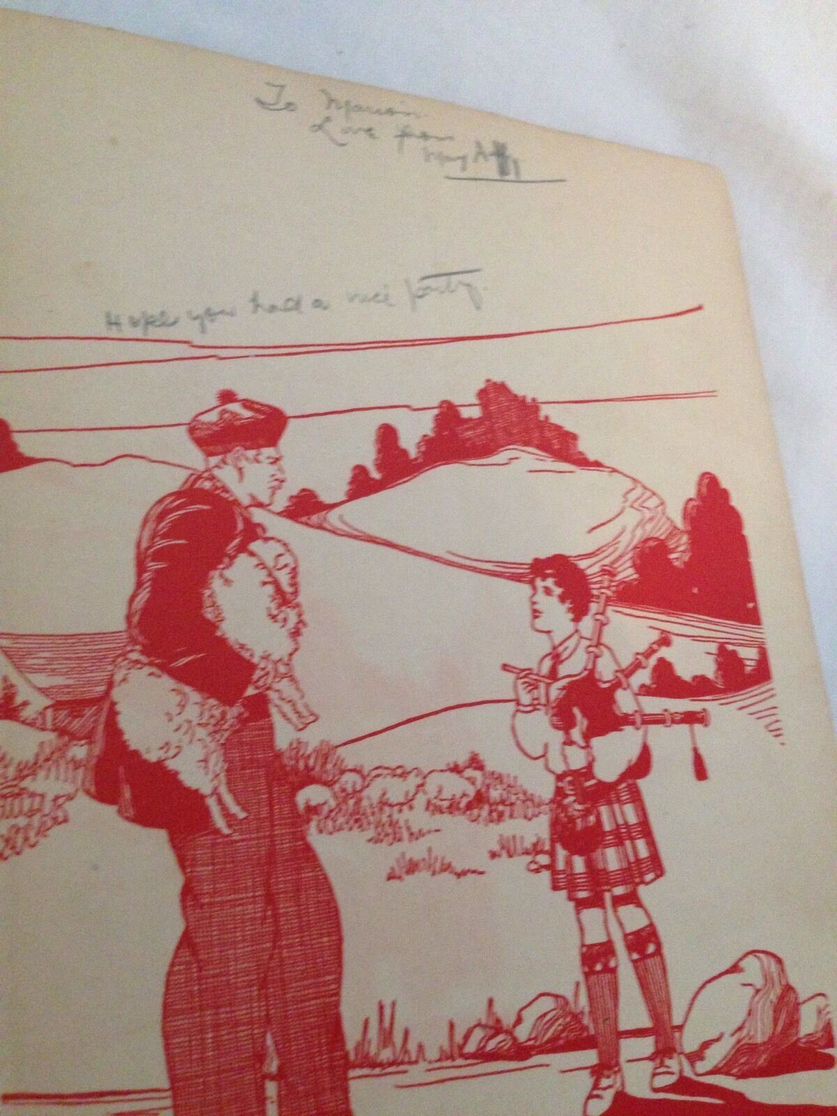 Illustration from The Wee Scotch Piper Book by Madeline Brandeis, depicting a man in traditional Scottish attire holding a small animal while a boy in a plaid outfit plays the bagpipes against a scenic landscape.