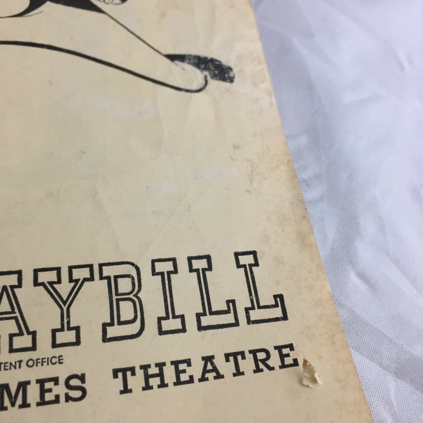 Detail shot of the corner of the Vintage June 1949 Broadway Theatre Playbill 'Where's Charley?' highlighting condition issues.