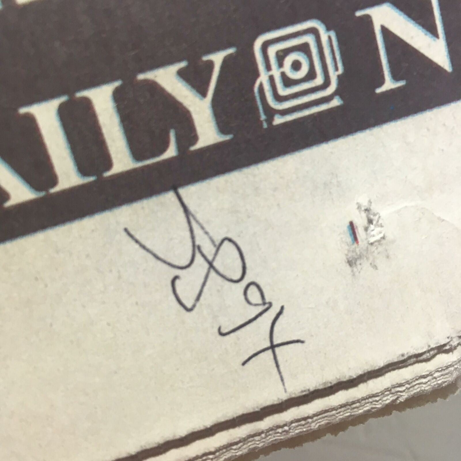 Detailed view of the NY Daily News: Oct 18 2000 All Aboard! showing a corner with handwritten notes and marks.