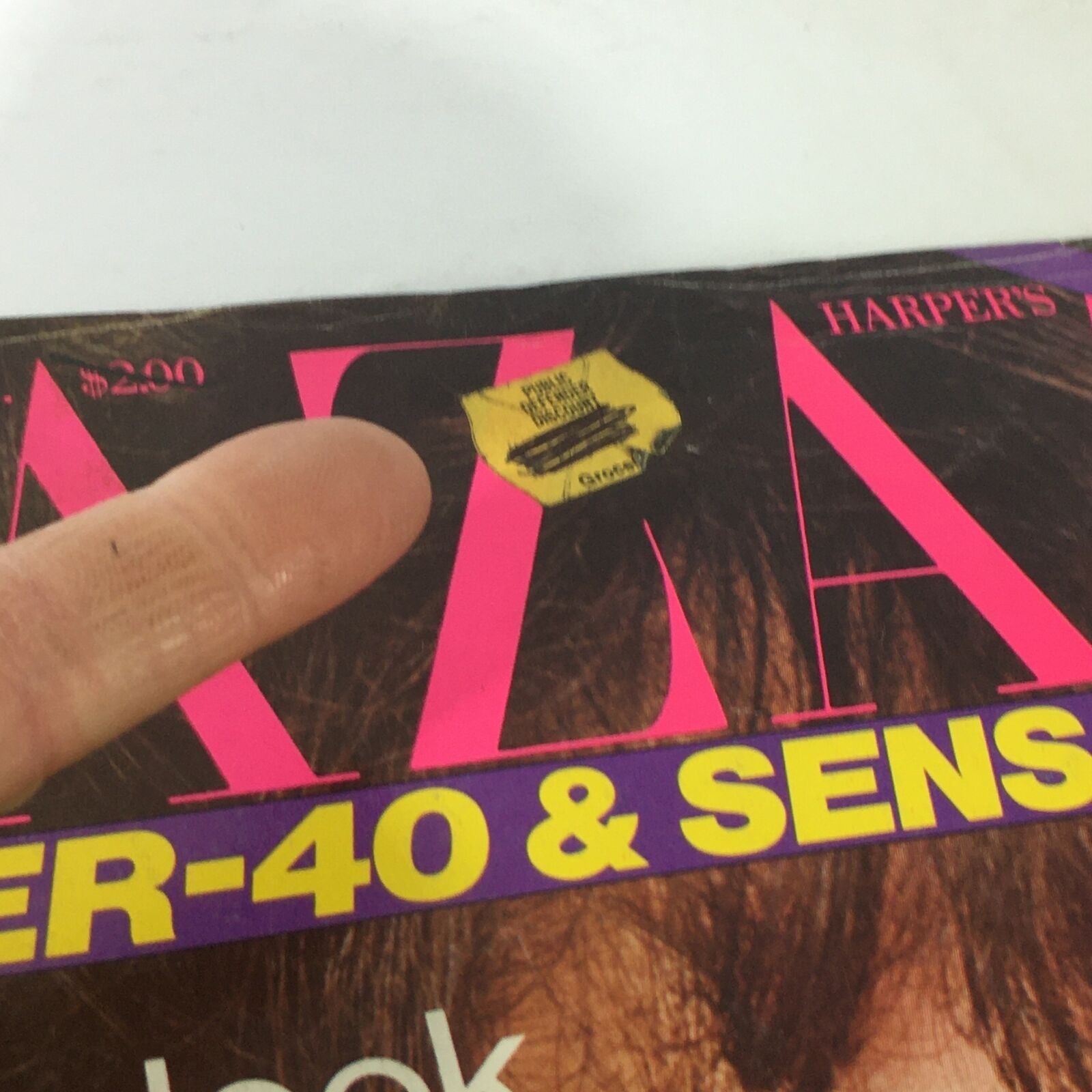 Close-up of the VTG Bazaar Magazine: September 1981, highlighting a small price sticker on the cover with the title 'OVER-40 & SENSATIONAL!' and articles related to beauty and health.