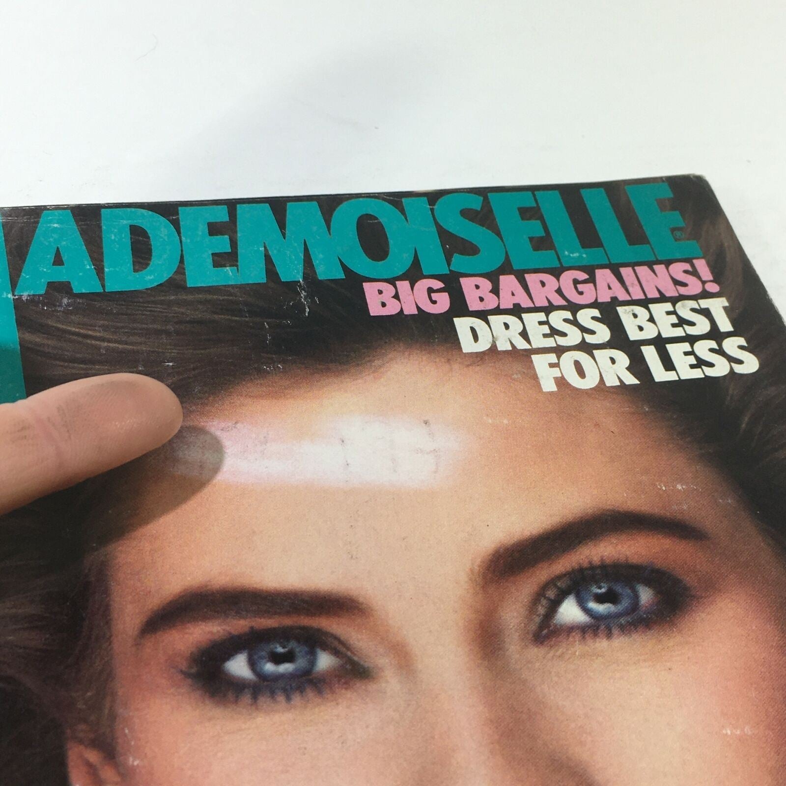 Detailed view of the Vintage Mademoiselle Magazine June 1982 cover, showcasing hair and makeup tips, emphasizing trends of the early 1980s.