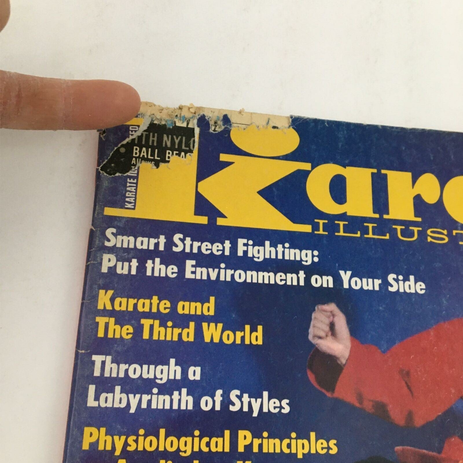 Top corner of the Karate Illustrated Magazine December 1979 cover, showing wear and features such as the title and various article highlights on martial arts.