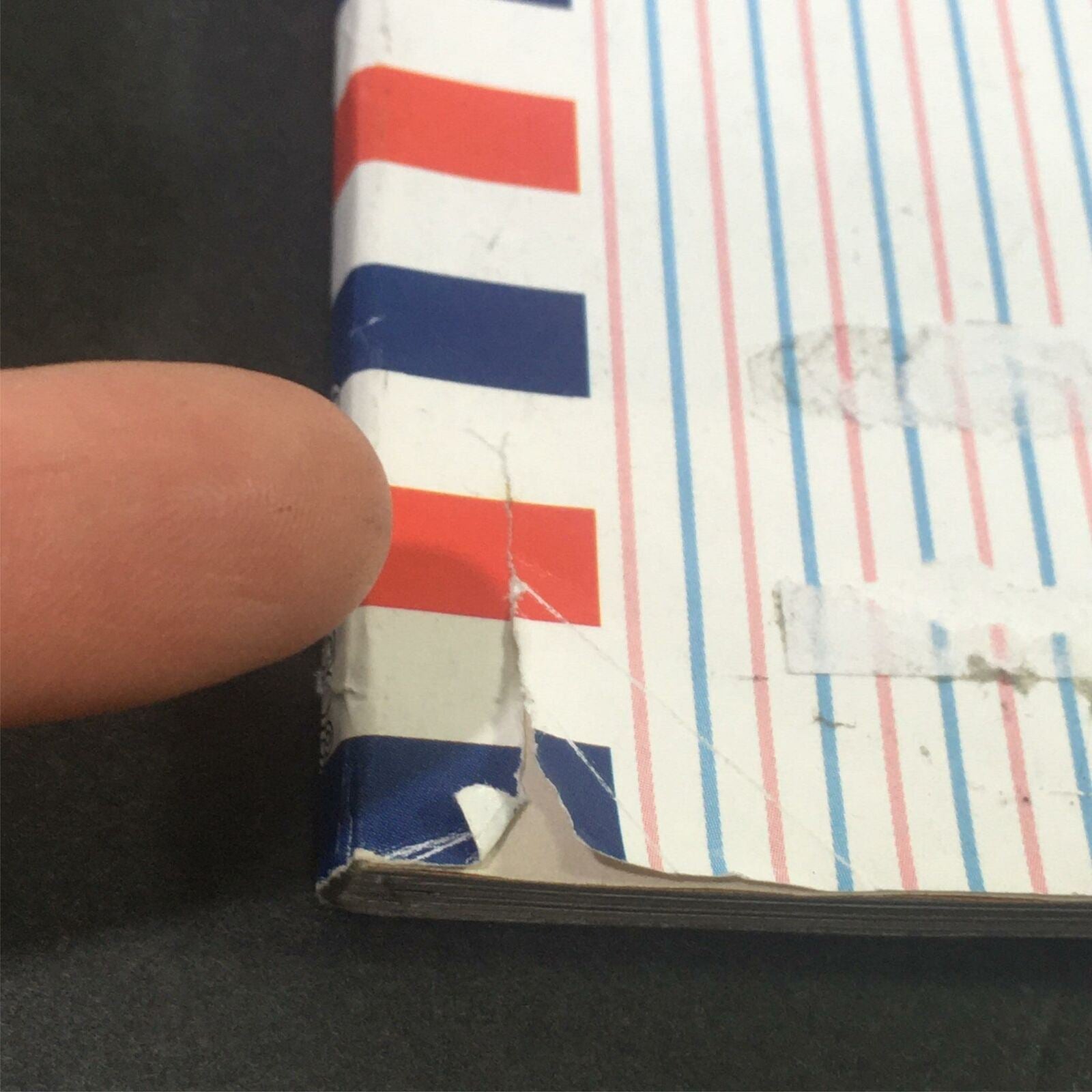 Detail of the spine of The New Yorker October 13 2008 magazine, highlighting minor wear with a small rip, an informative piece for collectors interested in vintage magazines.