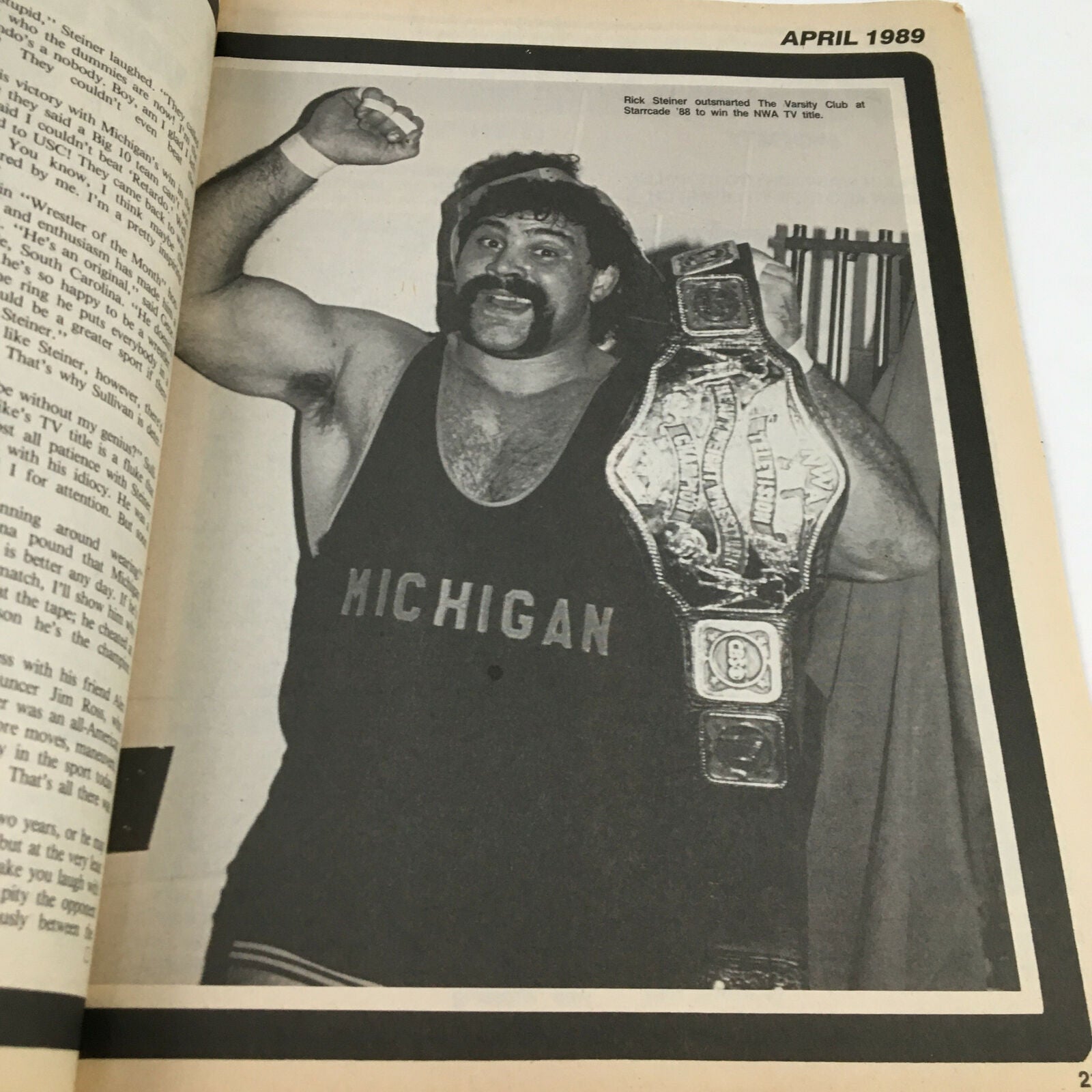April 1989 Sports Review Wrestling Magazine featuring a photo of a wrestler posing with a championship belt, highlighting the wrestling legacy of that era.